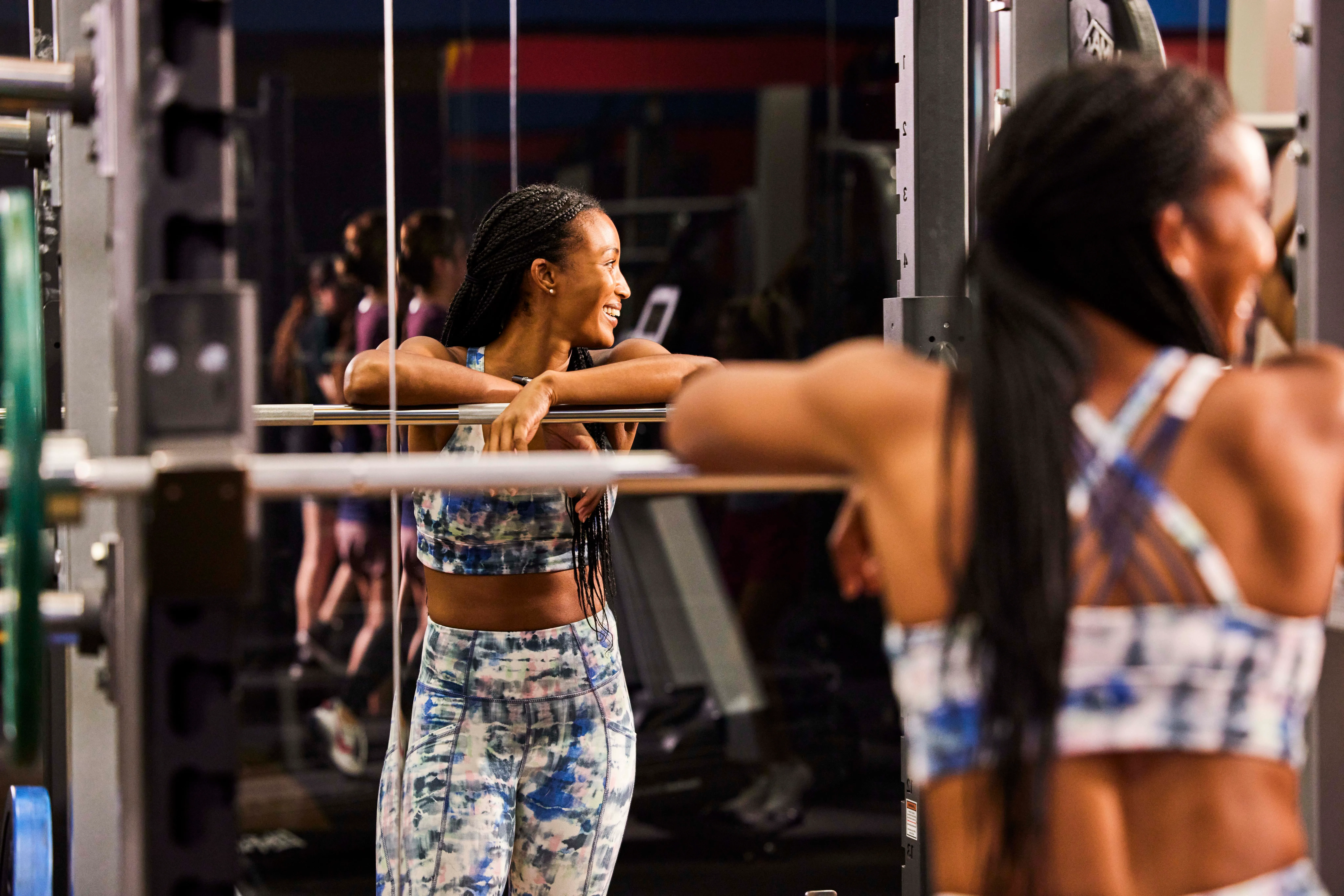 Women standing in front of a rail in the women's workout area at Fitness Connection