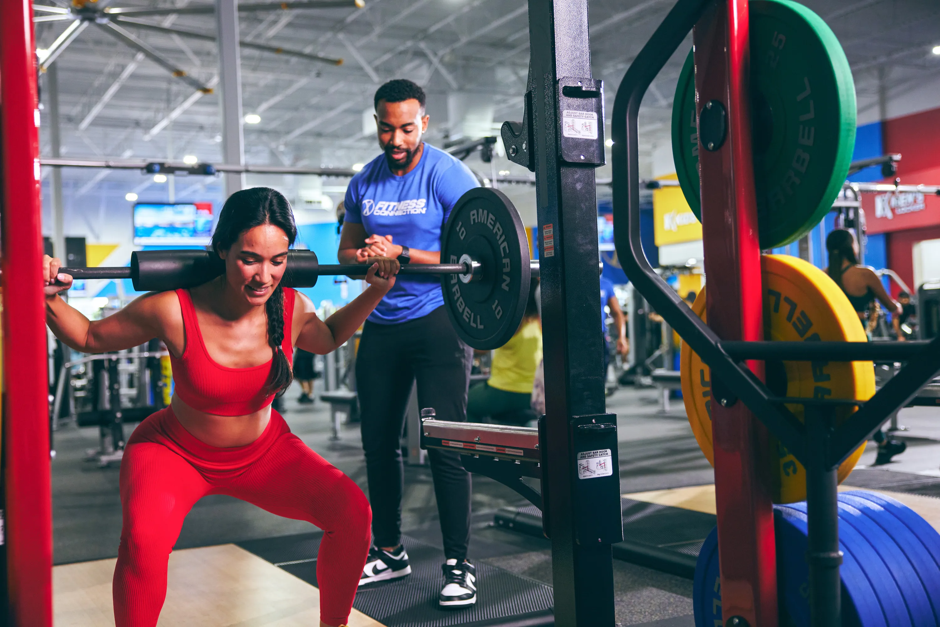 Women working out at a Fitness Connection being trained by a Fitness Connection professional