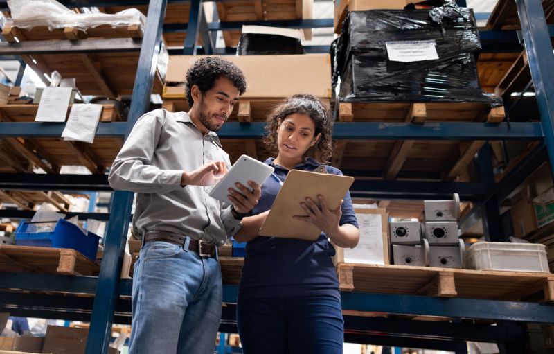 A man and a woman in a warehouse