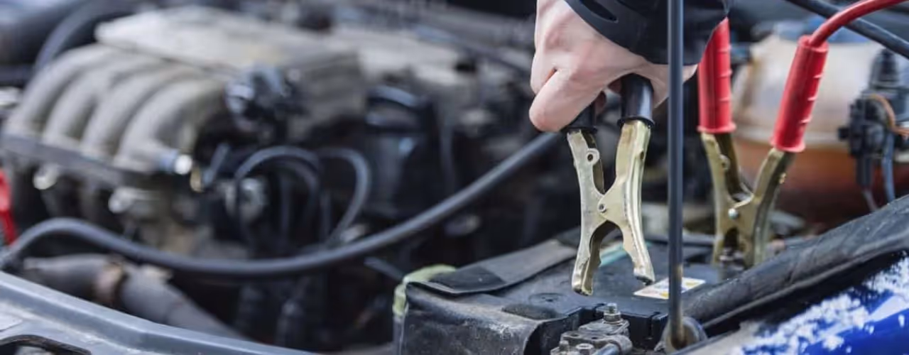 An image of a service professional working on a car