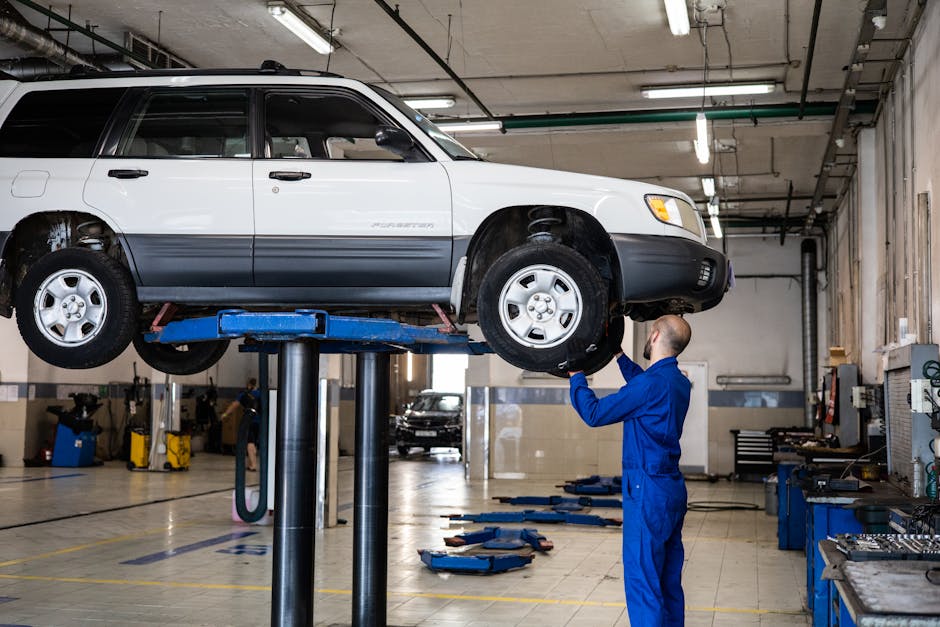 mechanic performing vehicle inspection - auto shop omaha mechanic performing vehicle inspection - auto shop omaha