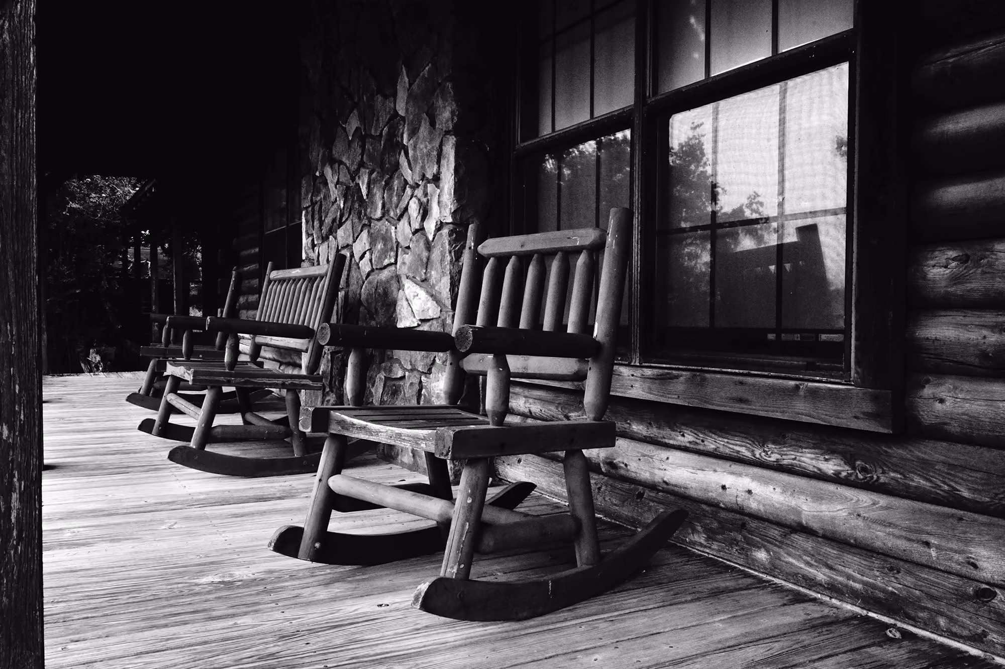Porch with rocking chairs.