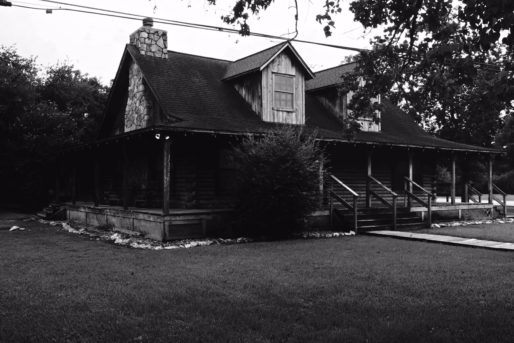 Porch with stone chimney.