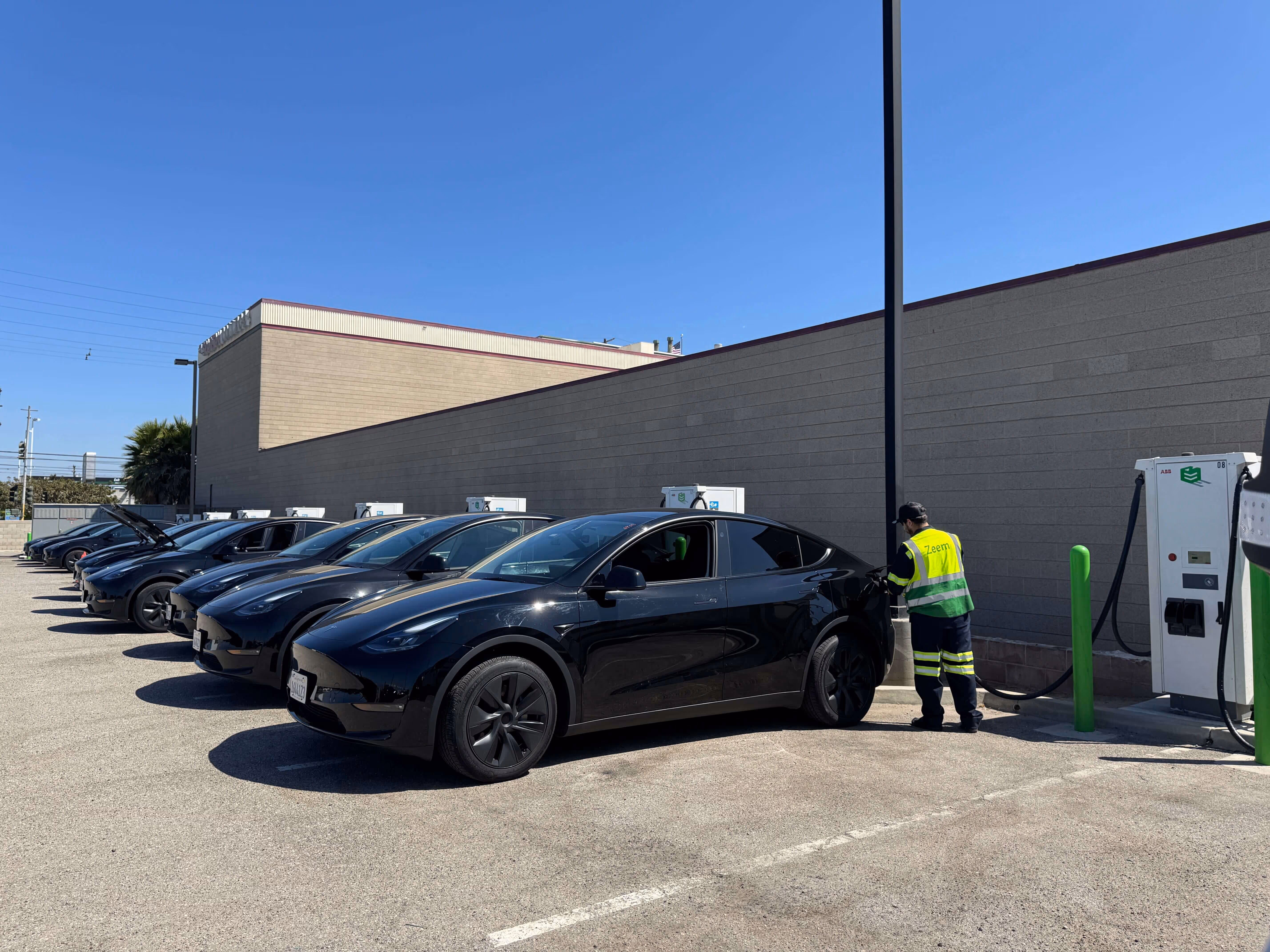 A Zeem attendant charges a vehicle in a Los Angeles depot.
