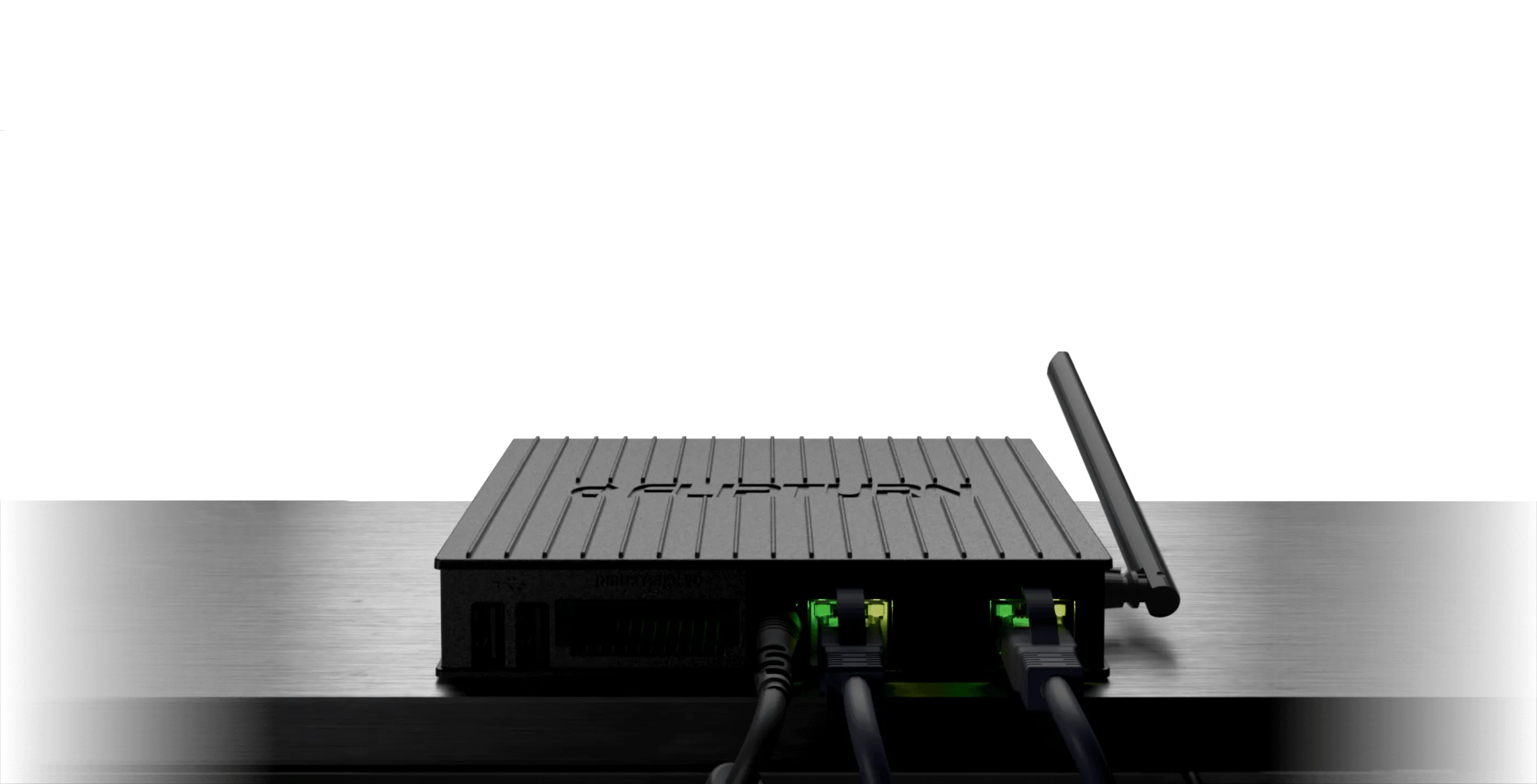 Flipturn's onsite controller device with antenna and two ethernet cables connected, placed on a metallic surface.