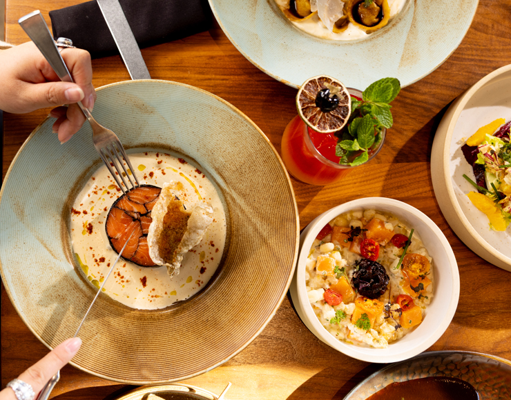 Different plates of dishes served in Level 5 on a table