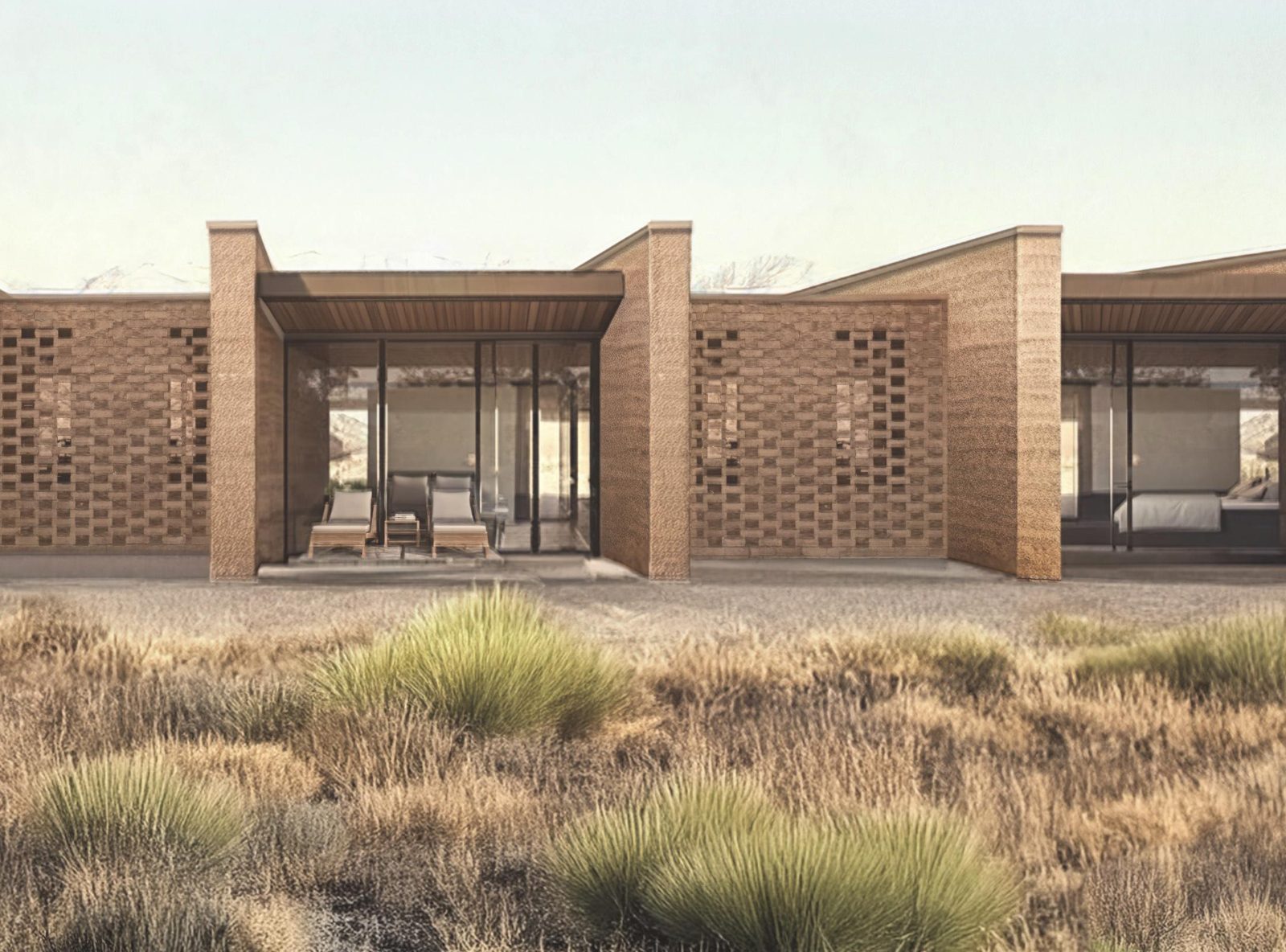 Kosmos Suites detail — covered porch with wood-framed sliding glass between perforated brick walls