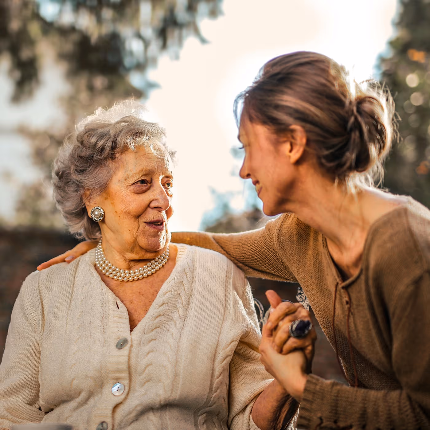 Woman having a conversation with her grandmother.