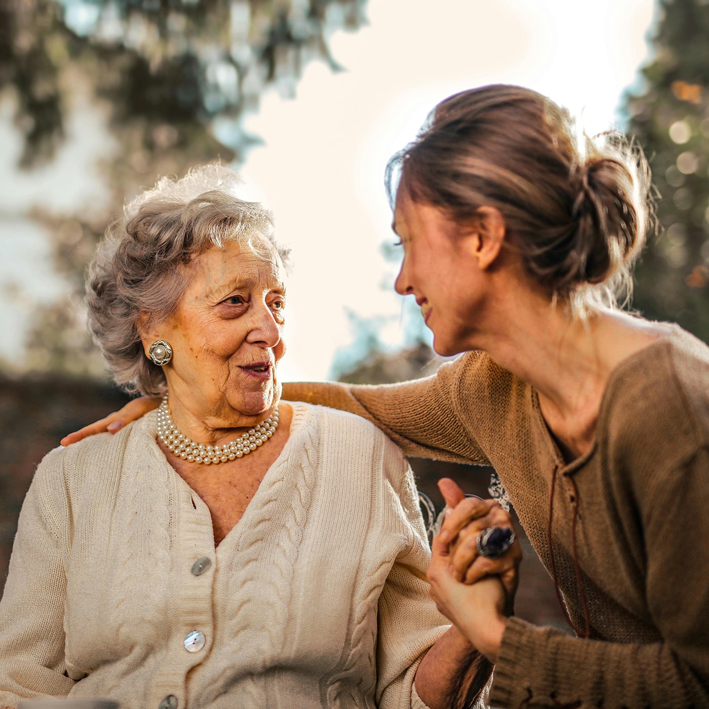 Woman having a conversation with her grandmother.