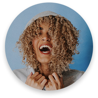 A circle with a woman laughing joyfully