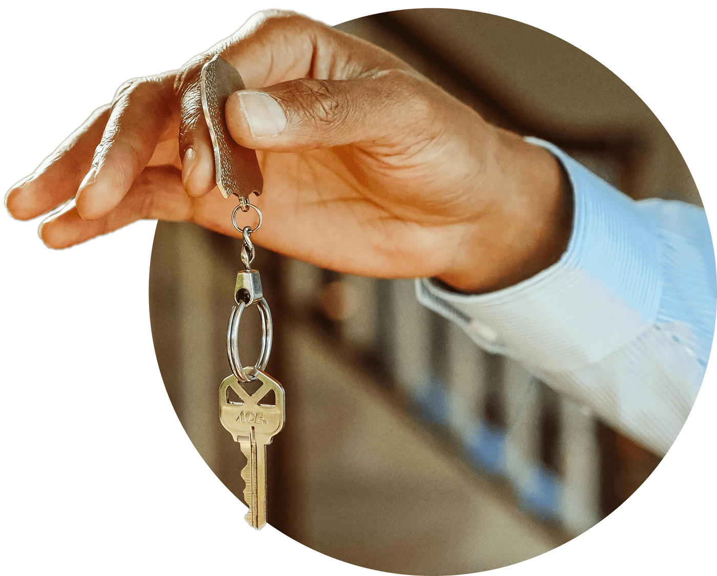 Hand holding out keys