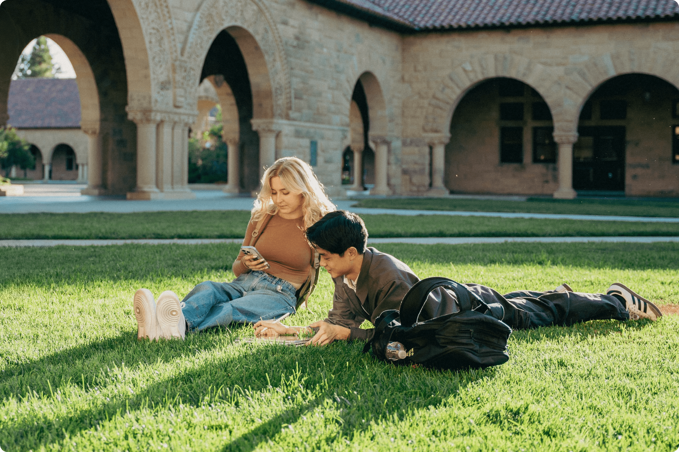 Two college students collaborate on a note in Notability on an iPhone and an iPad.