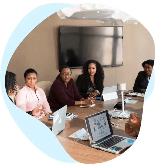 people in a board room having a meeting