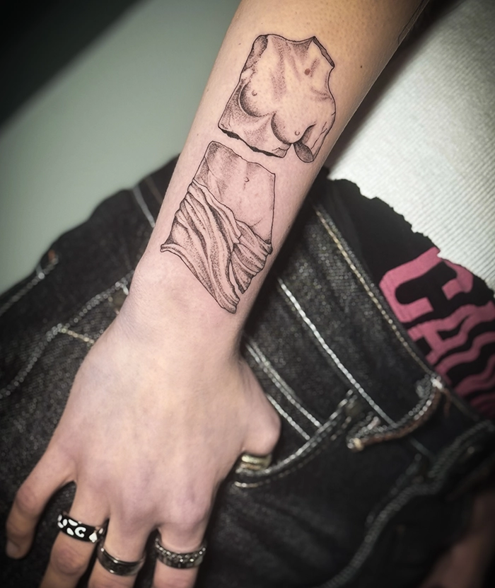 fine line bkinky tattoo