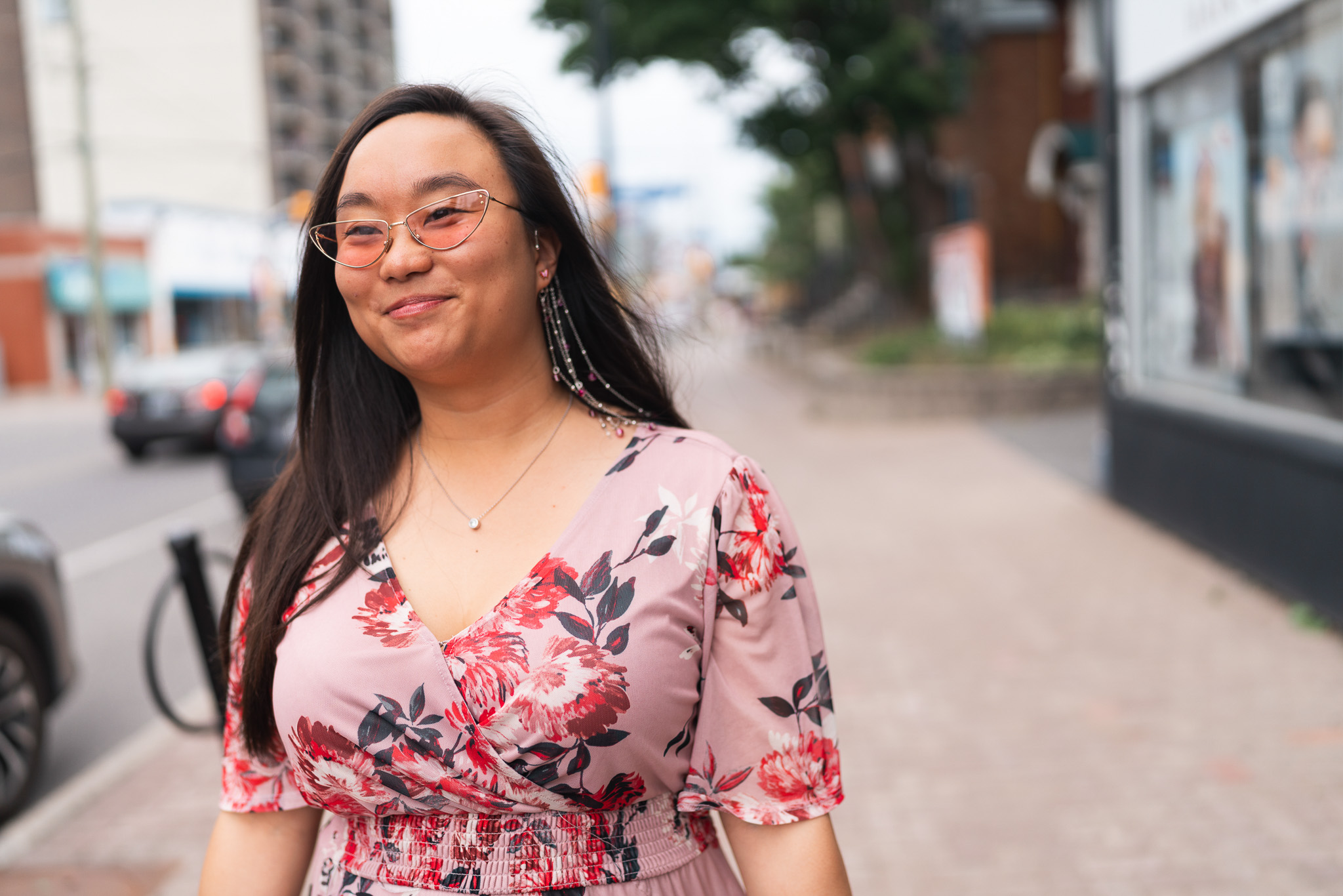 Woman walking happily with new glasses from Wellington Vision Care