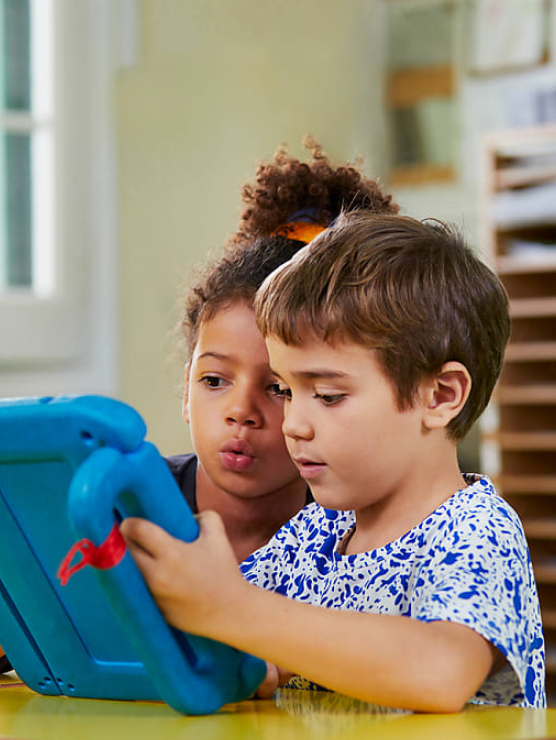 Children using a tablet to learn