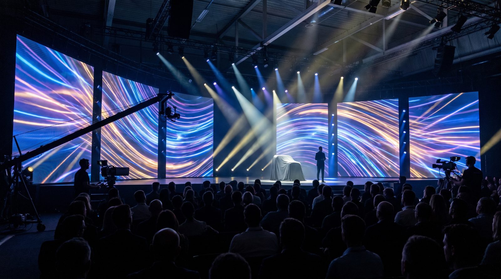 Product launch stage with curved LED video walls and dramatic lighting before a live audience