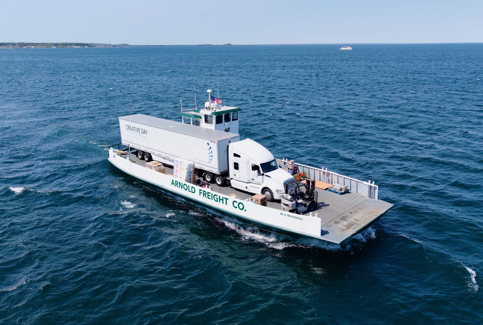 A freight truck crossing the Straits of Mackinac on an Arnold freight barge
