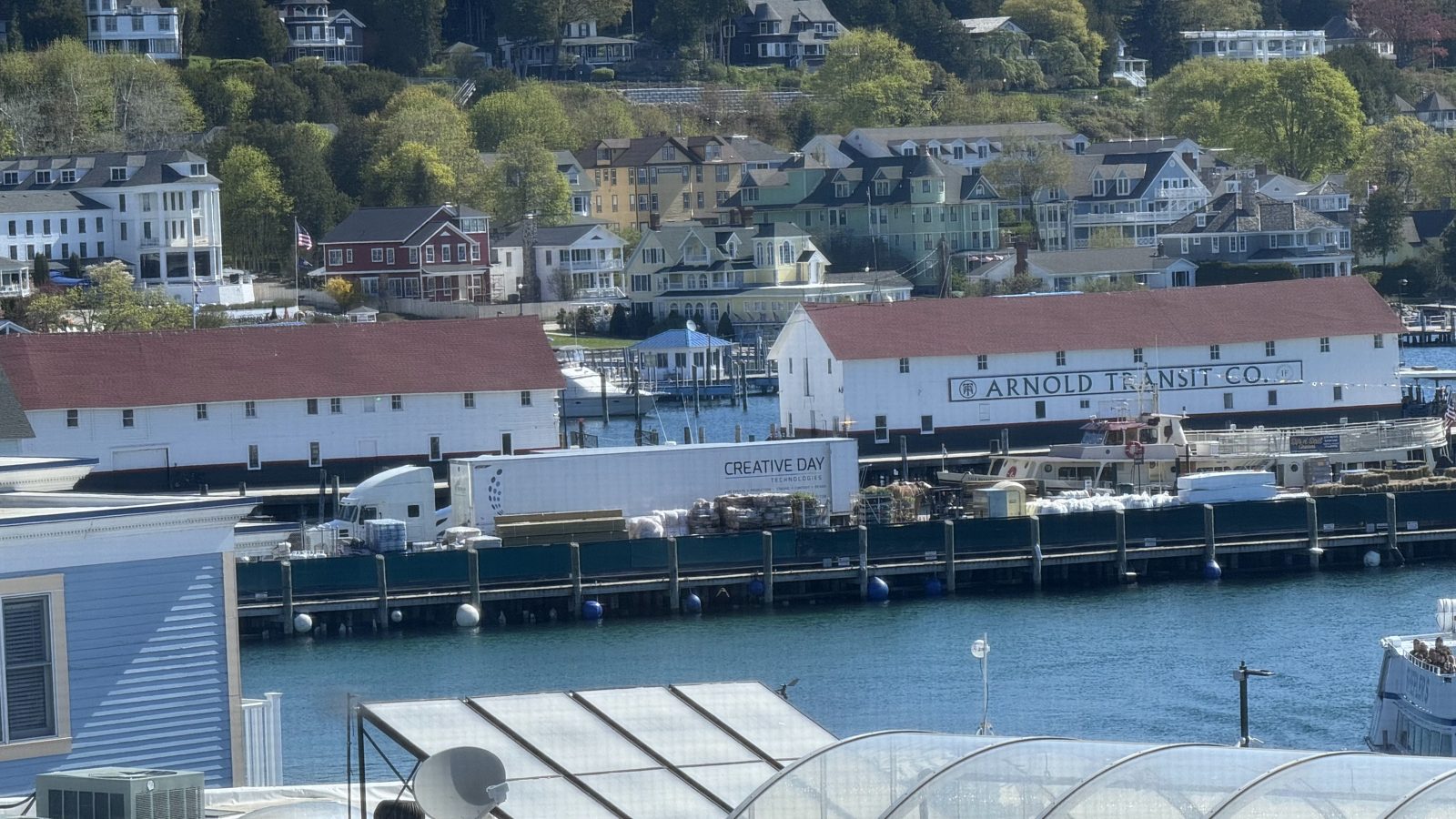 Aerial view of Mackinac Island harbor, town, and the Arnold freight dock