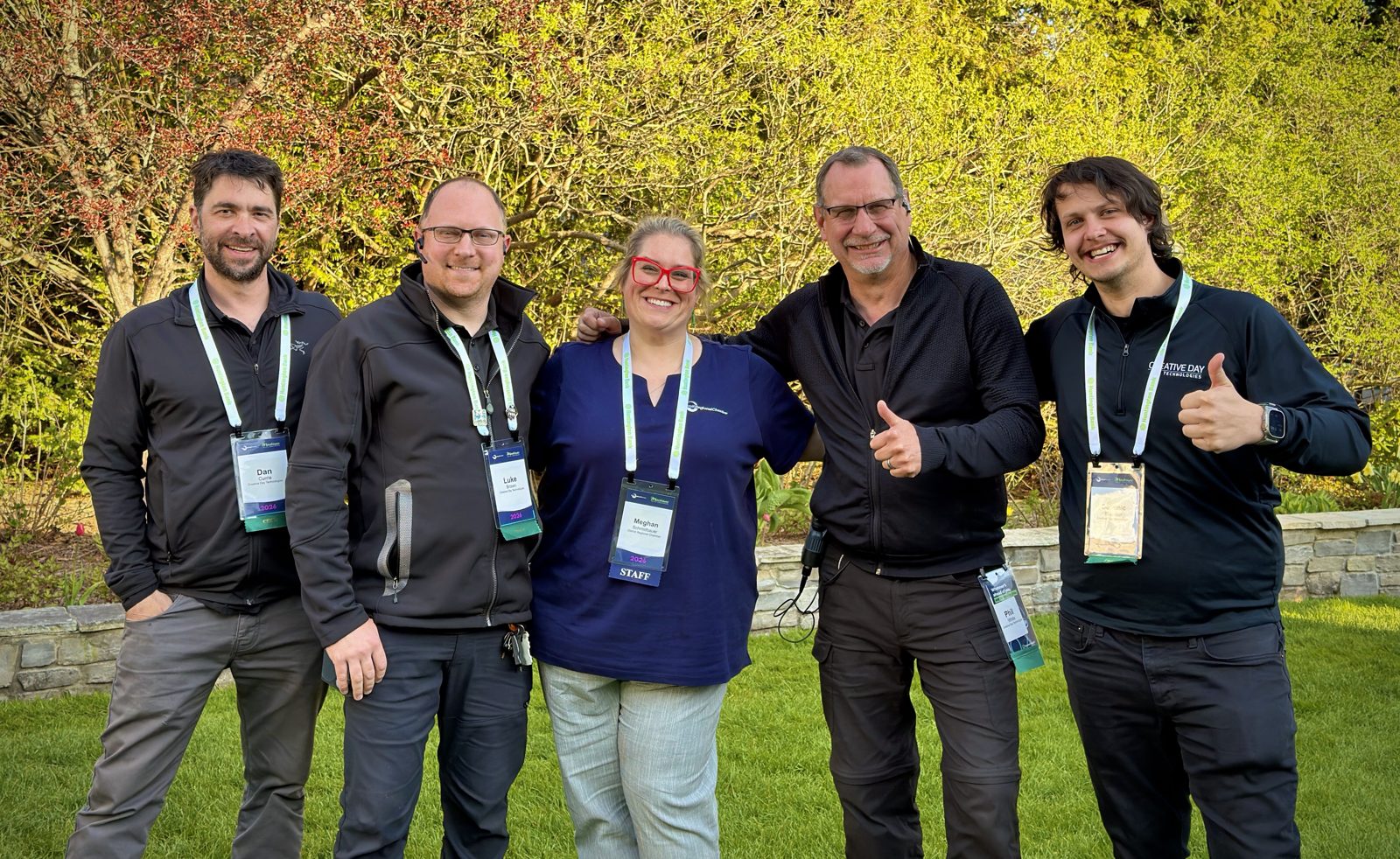 The Creative Day production team posing together outdoors at the event
