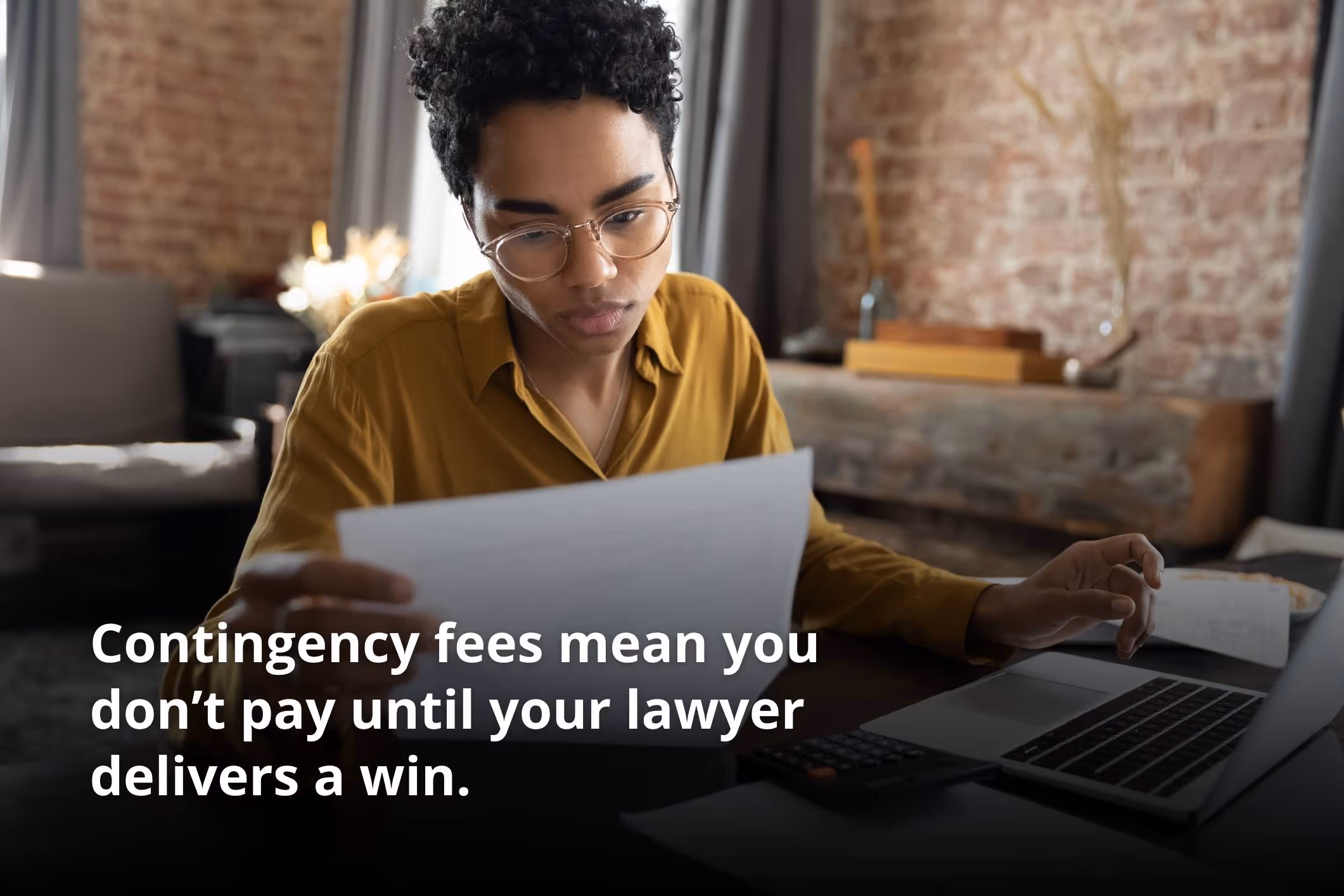 A woman looking at a document explaining what does it cost to sue someone.