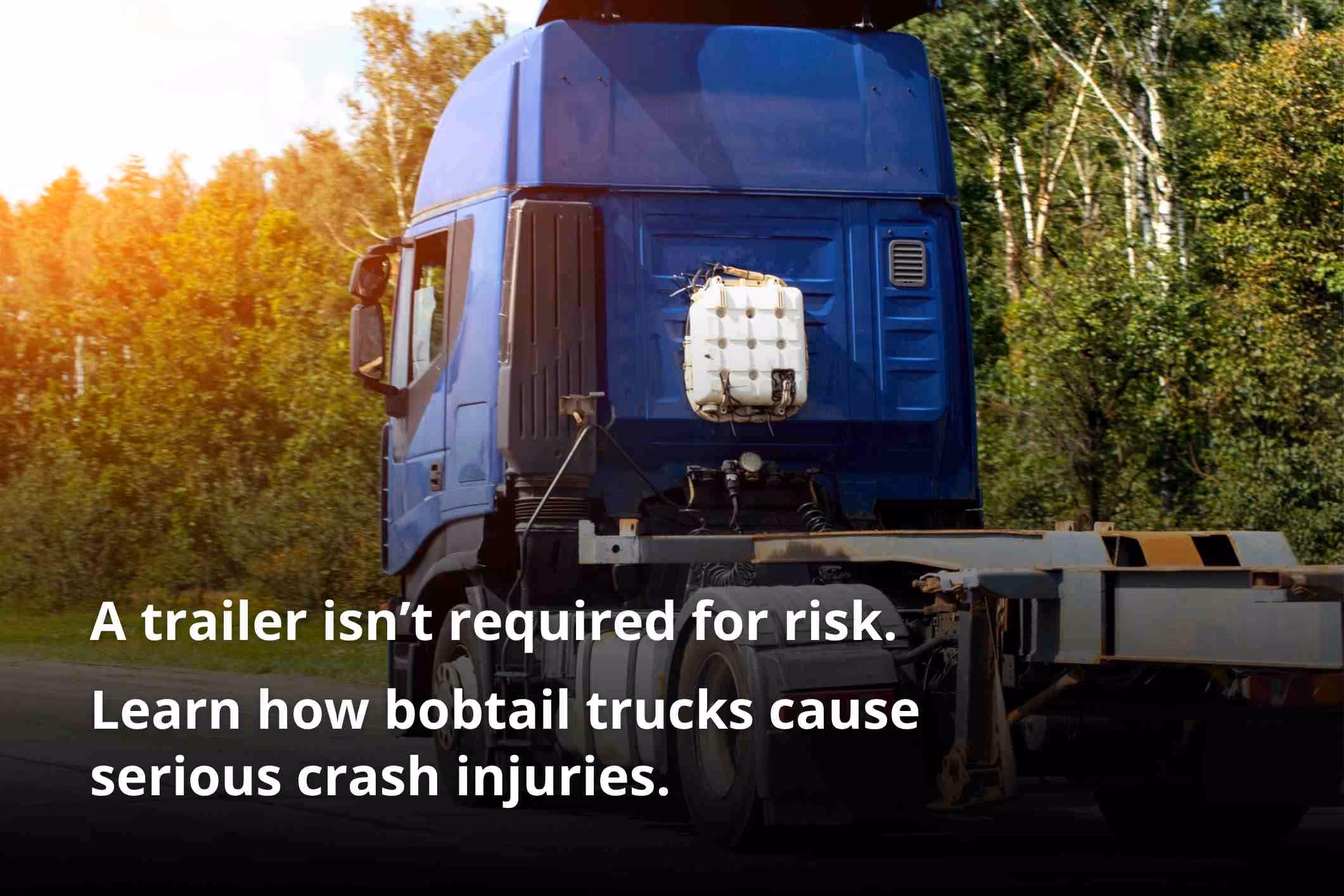 Cargo truck driving without a trailer, illustrating what is bobtailing in commercial trucking.