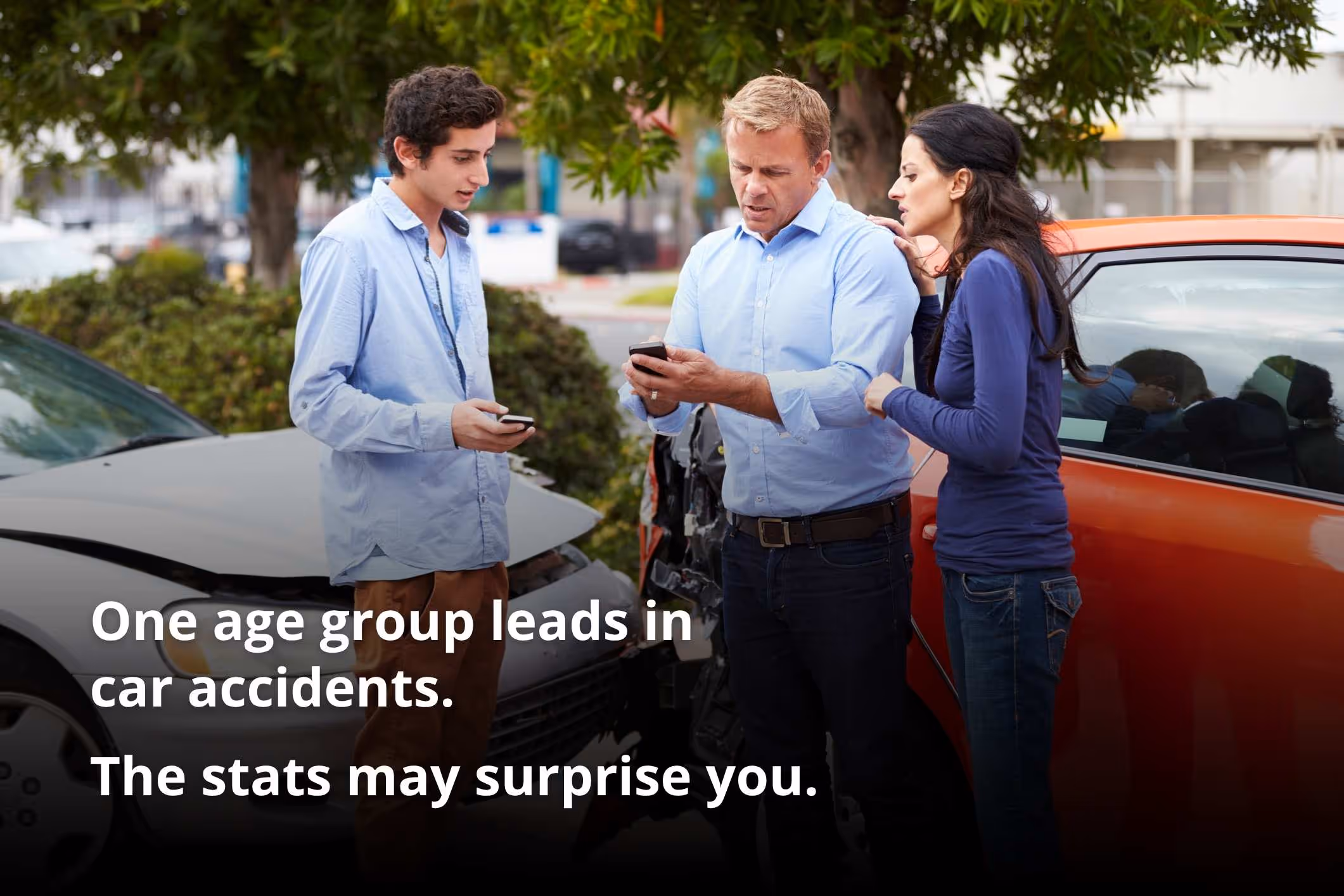 Drivers exchange insurance details after a crash, illustrating what age group causes the most car accidents.