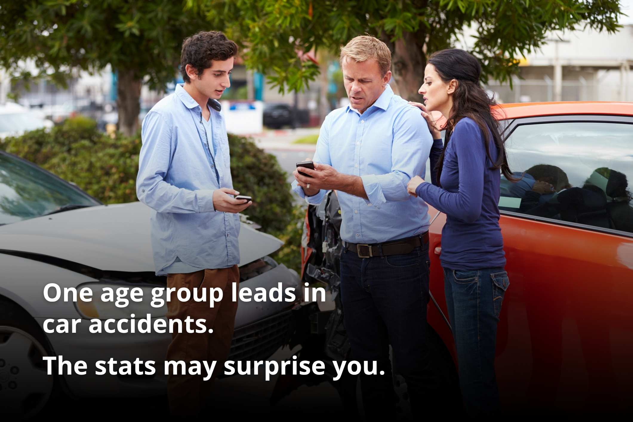  Drivers exchange insurance details after a crash, illustrating what age group causes the most car accidents.