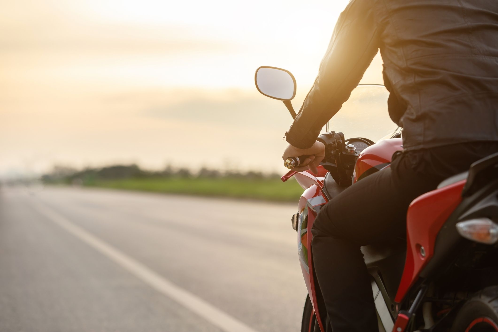 Motorcyclist riding through Suffolk, representing the need for a Suffolk motorcycle accident lawyer after a crash.