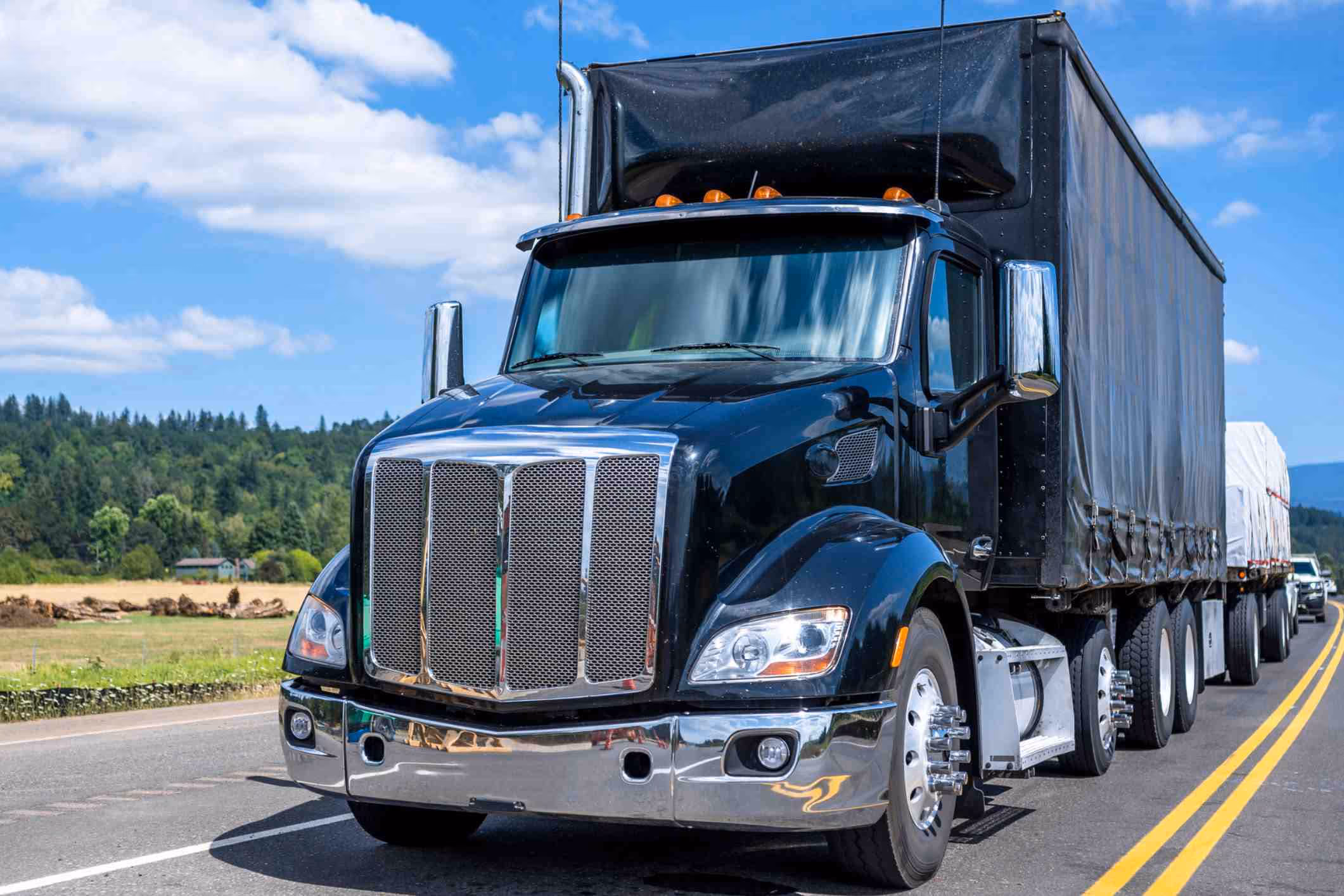 Commercial semi-truck on highway, representing Chesapeake truck accident lawyer injury cases.