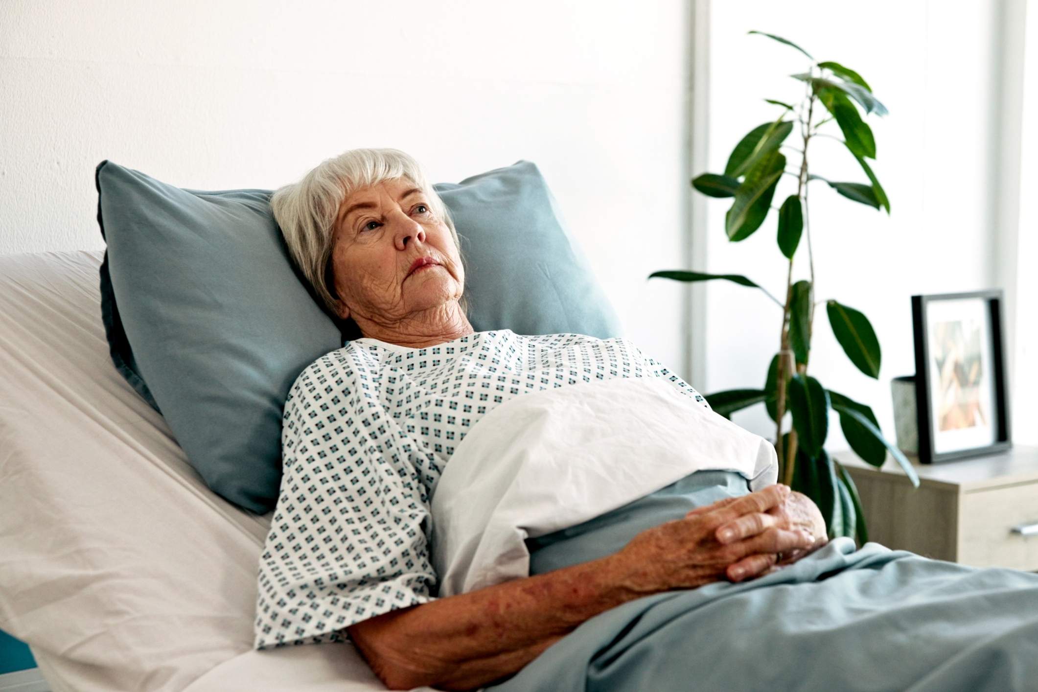 Older woman is facing bedsores in nursing home.