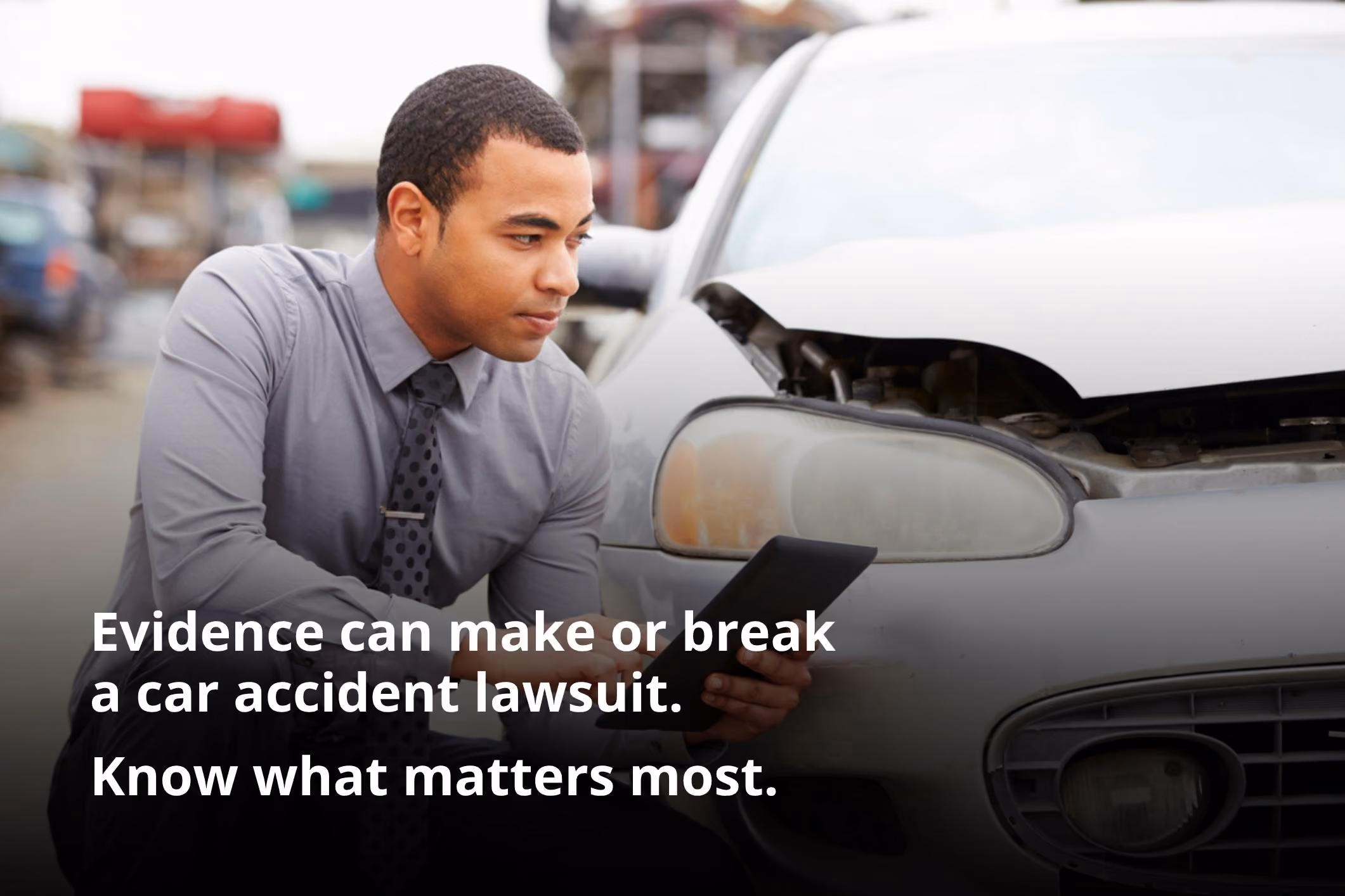 Insurance adjuster reviewing crash records for evidence needed for successful car accident lawsuit.