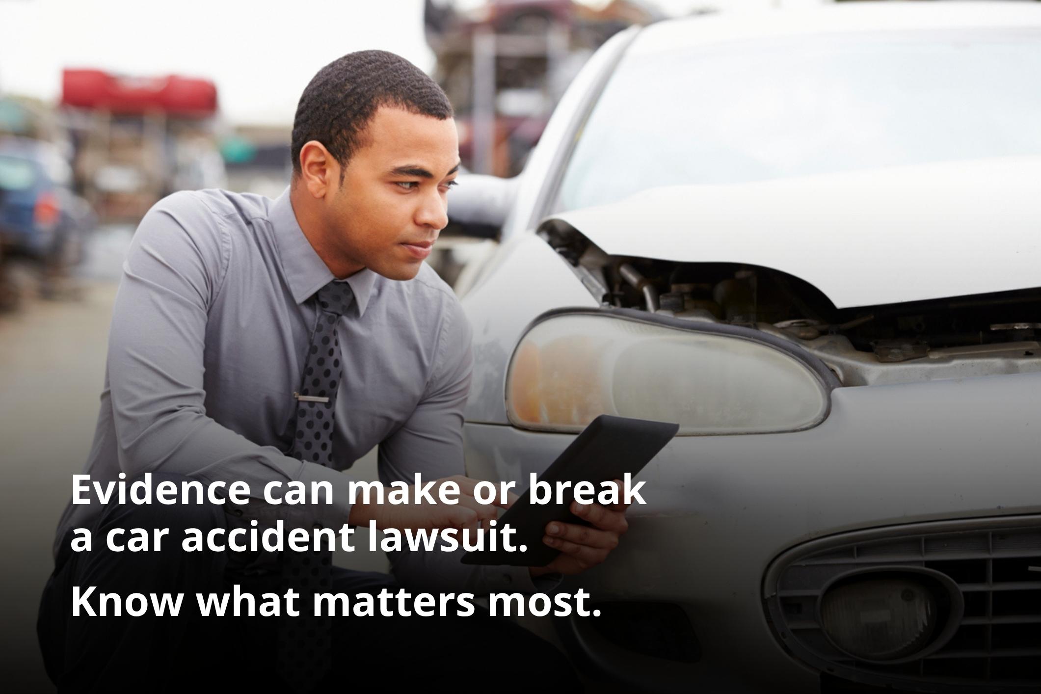 Insurance adjuster reviewing crash records for evidence needed for successful car accident lawsuit.