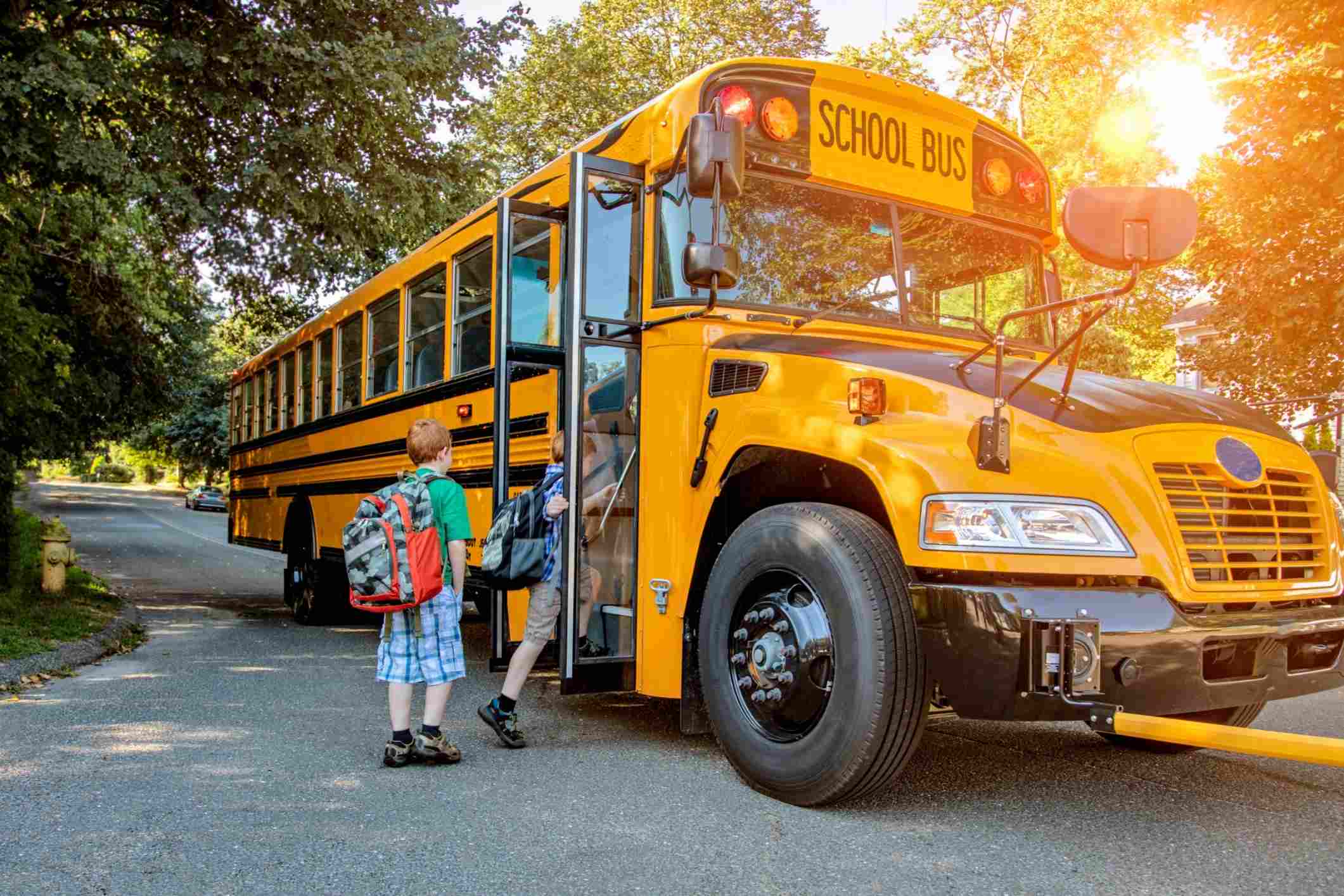 Young boy boarding school bus, representing Virginia school bus accident lawyer cases.