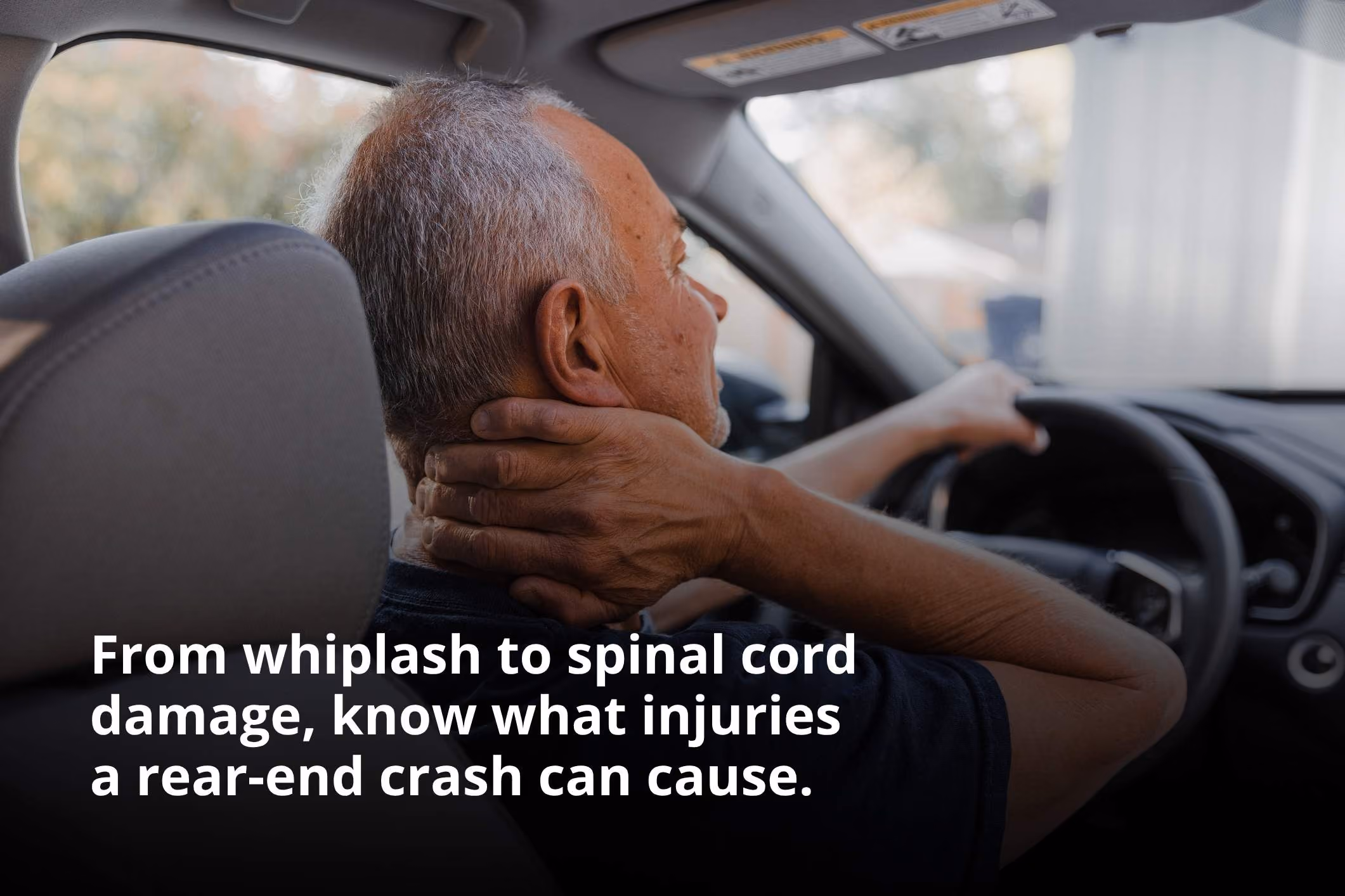 Middle-aged man holding his neck in pain, representing common rear-end collision injuries.
