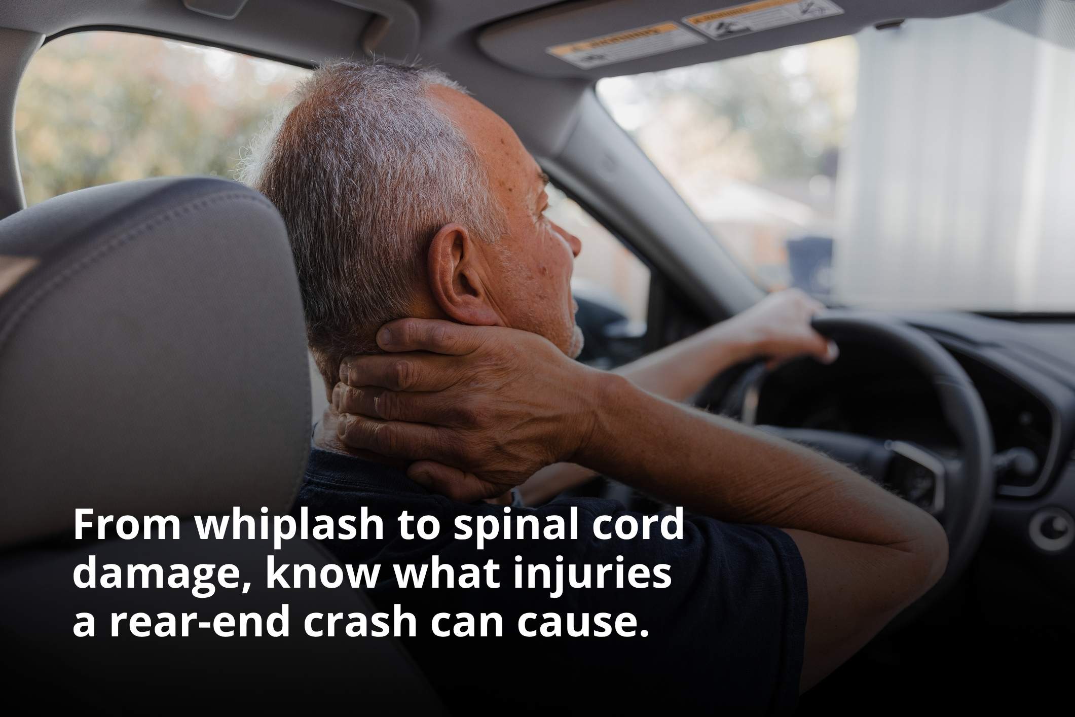 Middle-aged man holding his neck in pain, representing common rear-end collision injuries.