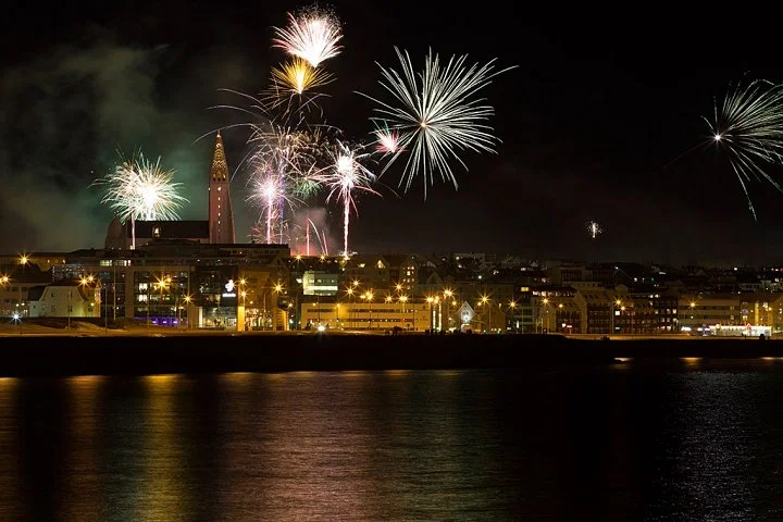 Fireworks over the water on the New Year's Eve Reykjavík Cruise