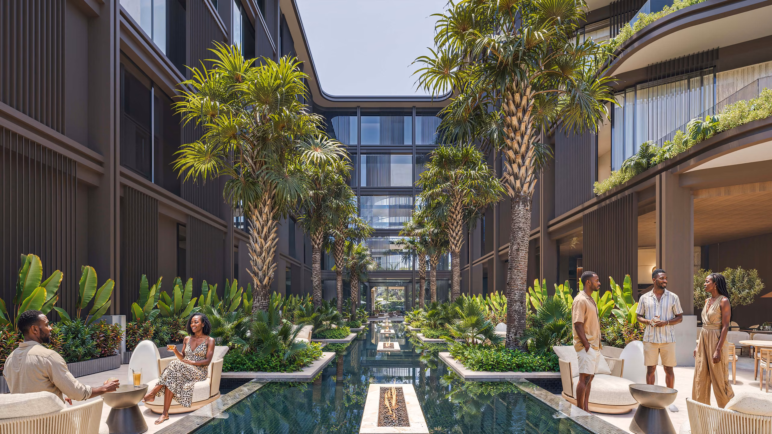 Tropical courtyard with reflecting pools between the hotel wings — AQQUAABA resort visualisation