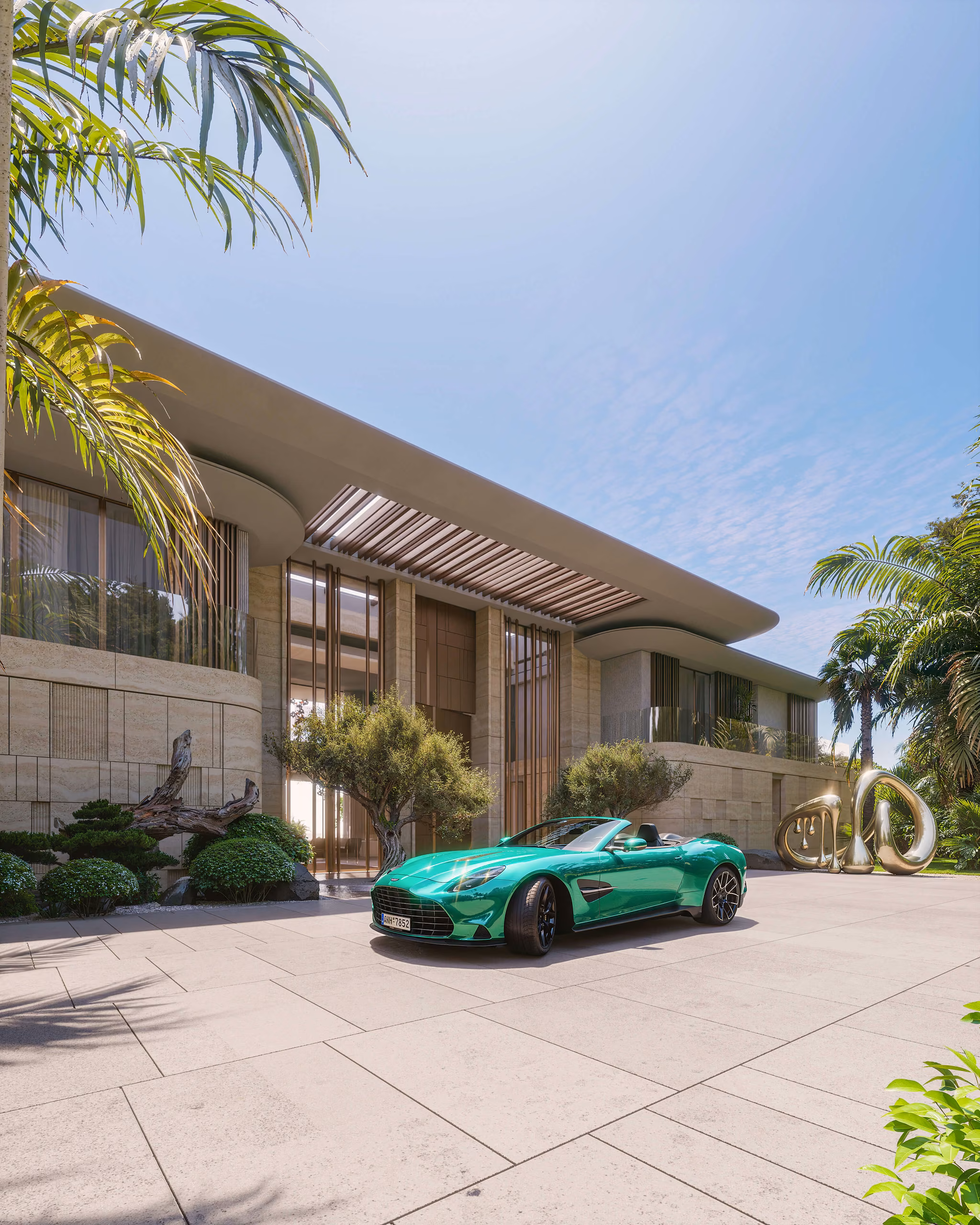 Villa entrance with large glazed panels, a curved roof and a green convertible in the courtyard.