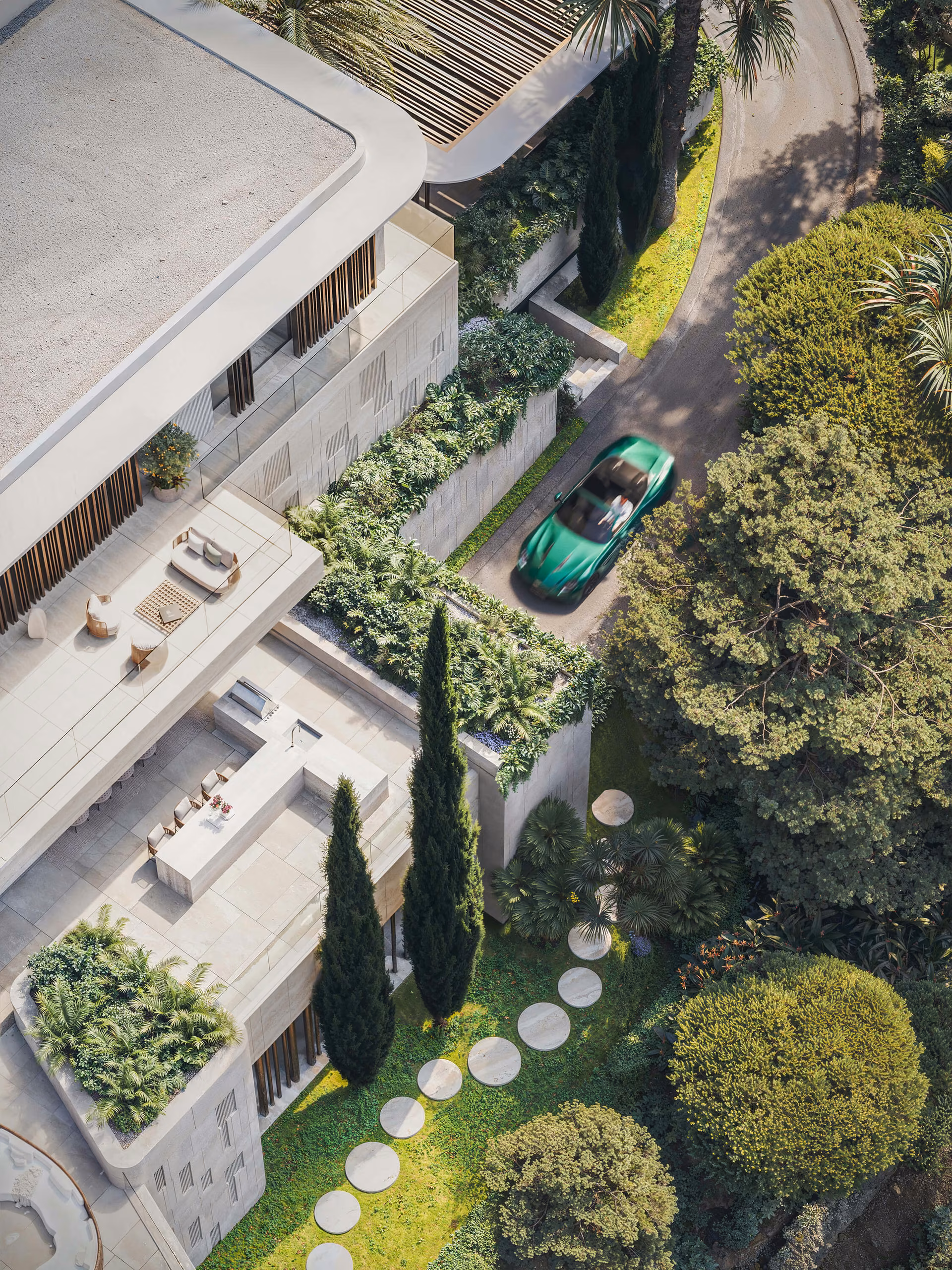 Overhead view of the balconies, garden and approach road beside the villa.
