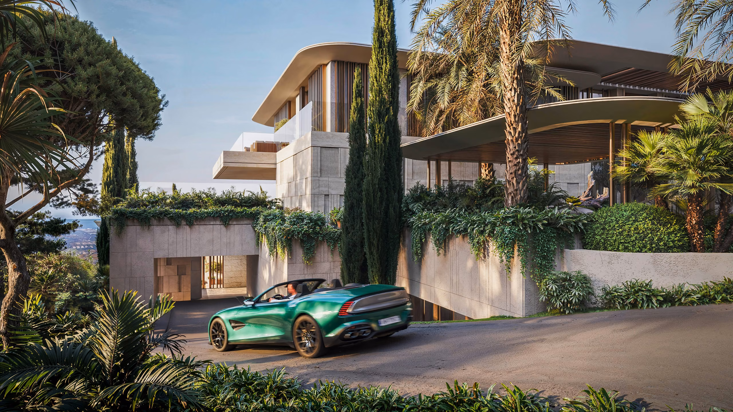 Garage access ramp beneath a raised garden of palms and cypresses, with a green convertible.