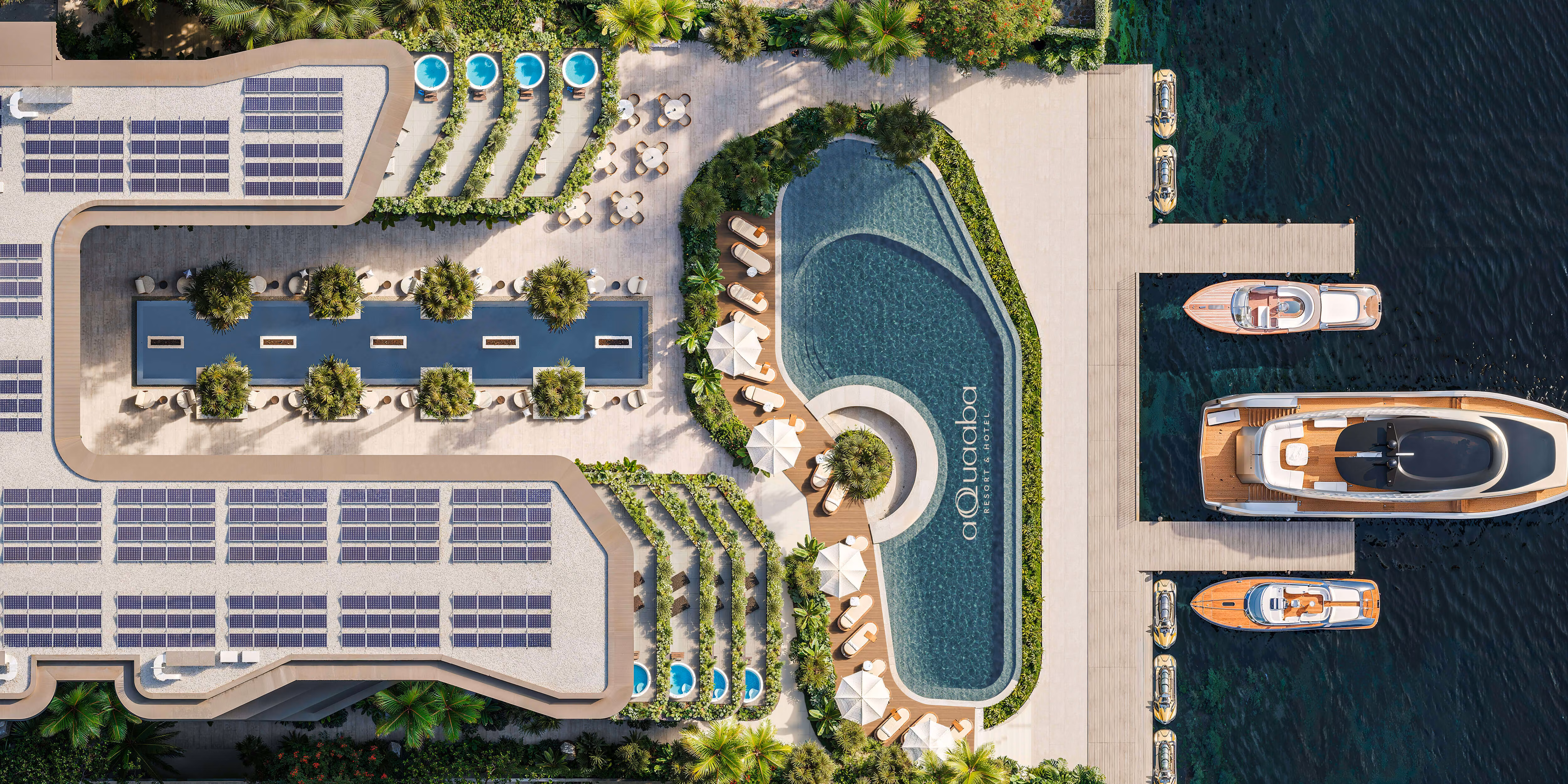 Overhead view of the hotel roofs, courtyard, pool and private marina — AQQUAABA