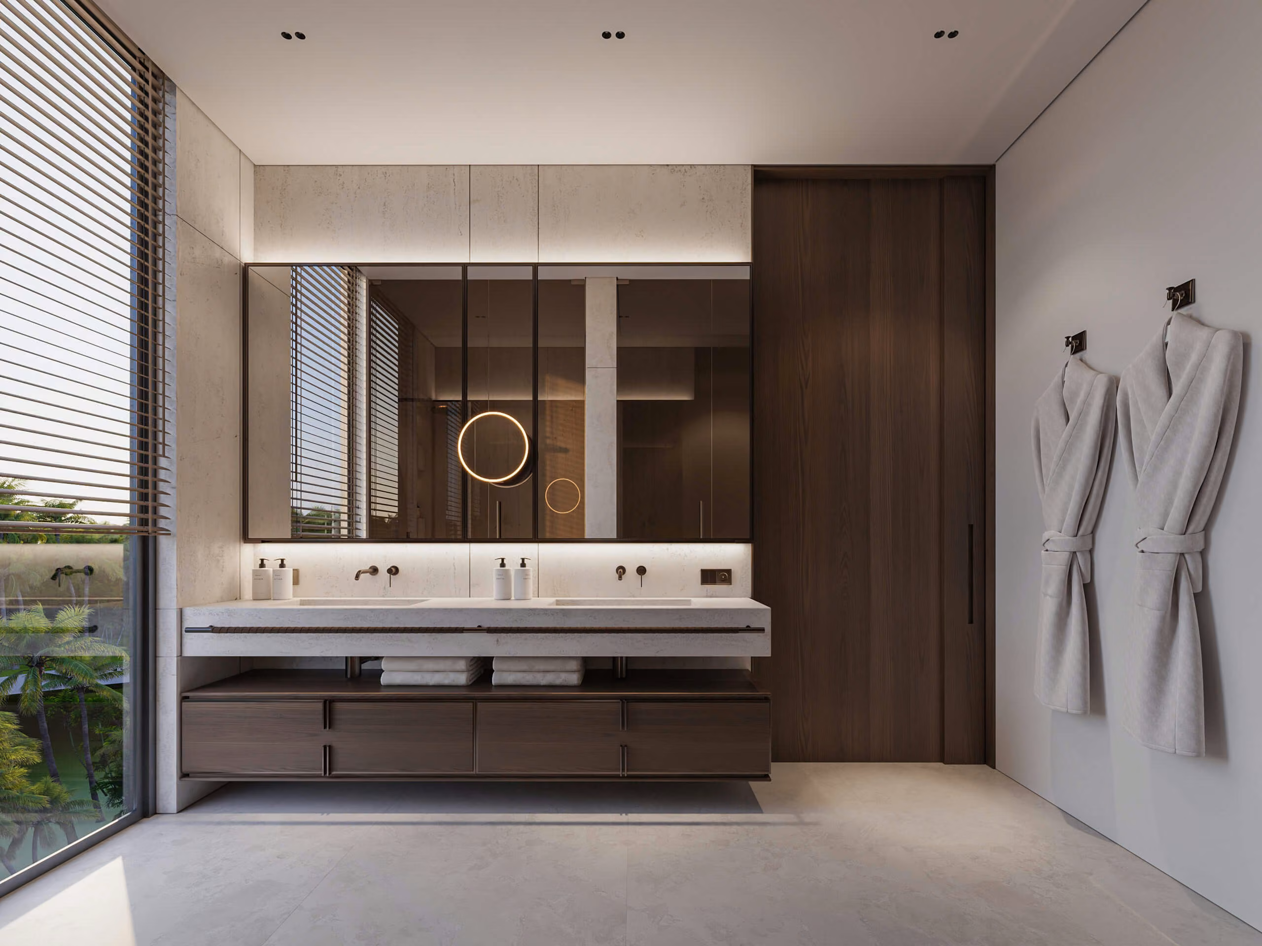Aqquaaba bathroom with a double vanity, wide mirror and bathrobes beside a window with blinds.