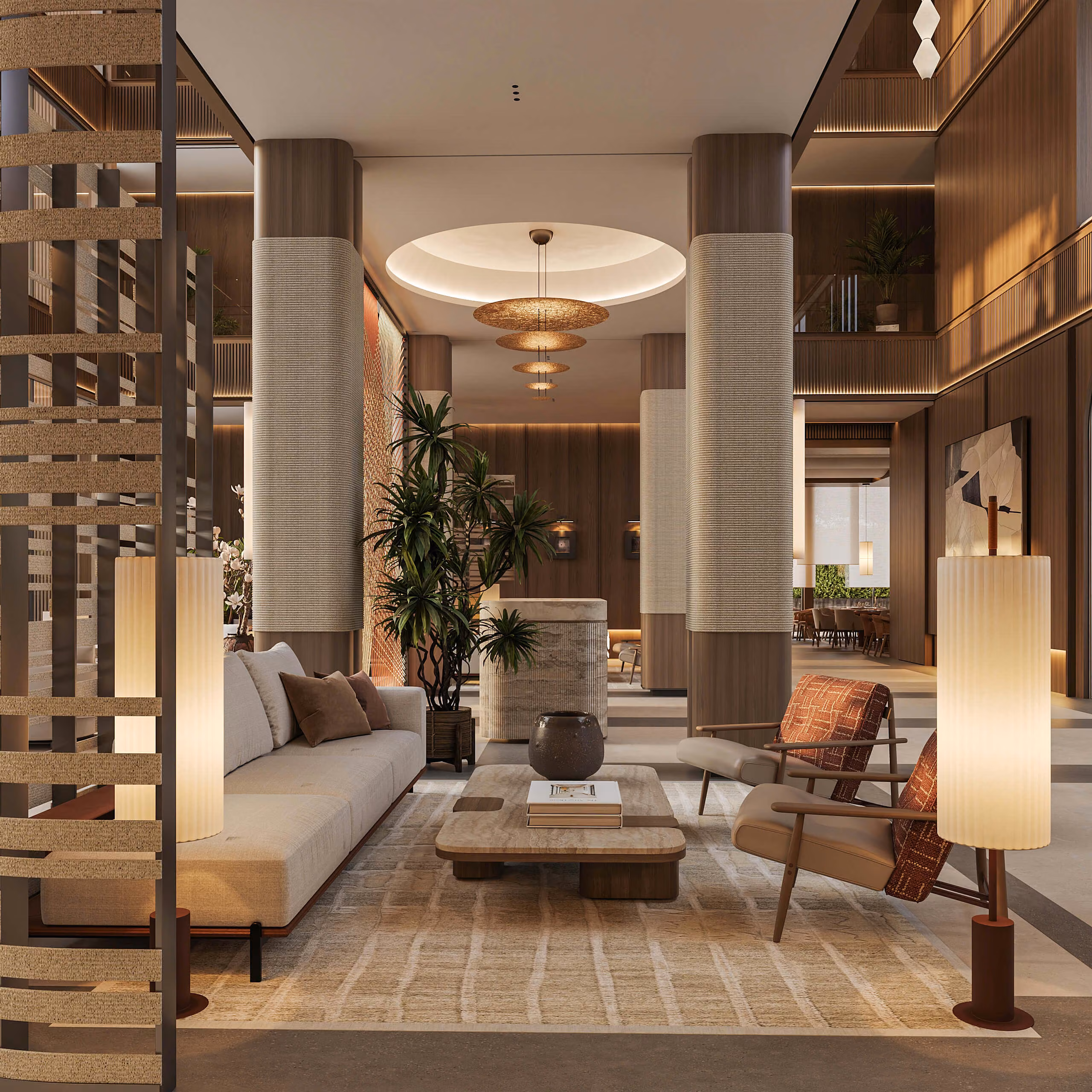 Aqquaaba lobby lounge with a light sofa, armchairs and a coffee table between columns.
