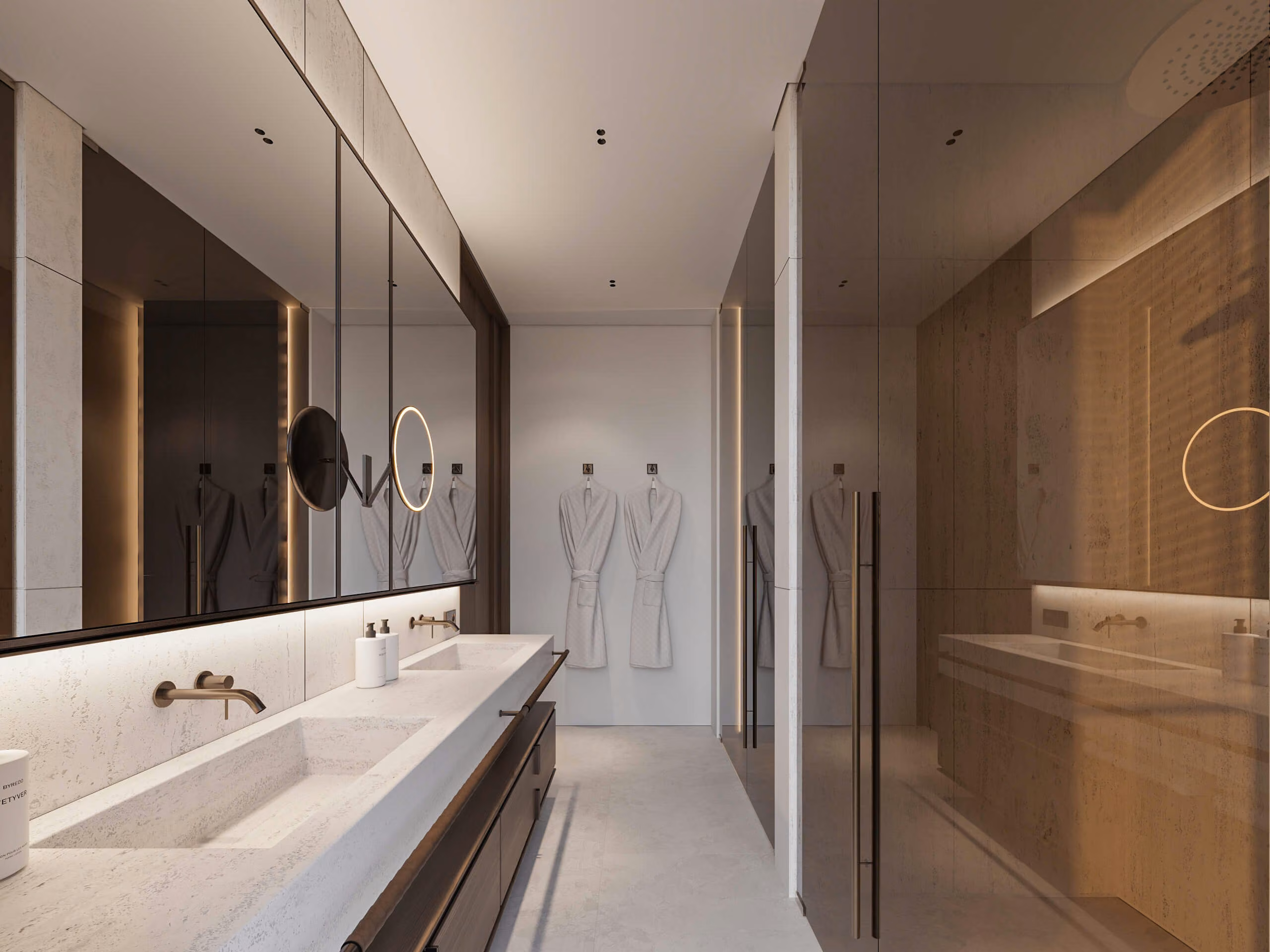 Aqquaaba bathroom with a long counter, mirror and shower enclosed in tinted glass.