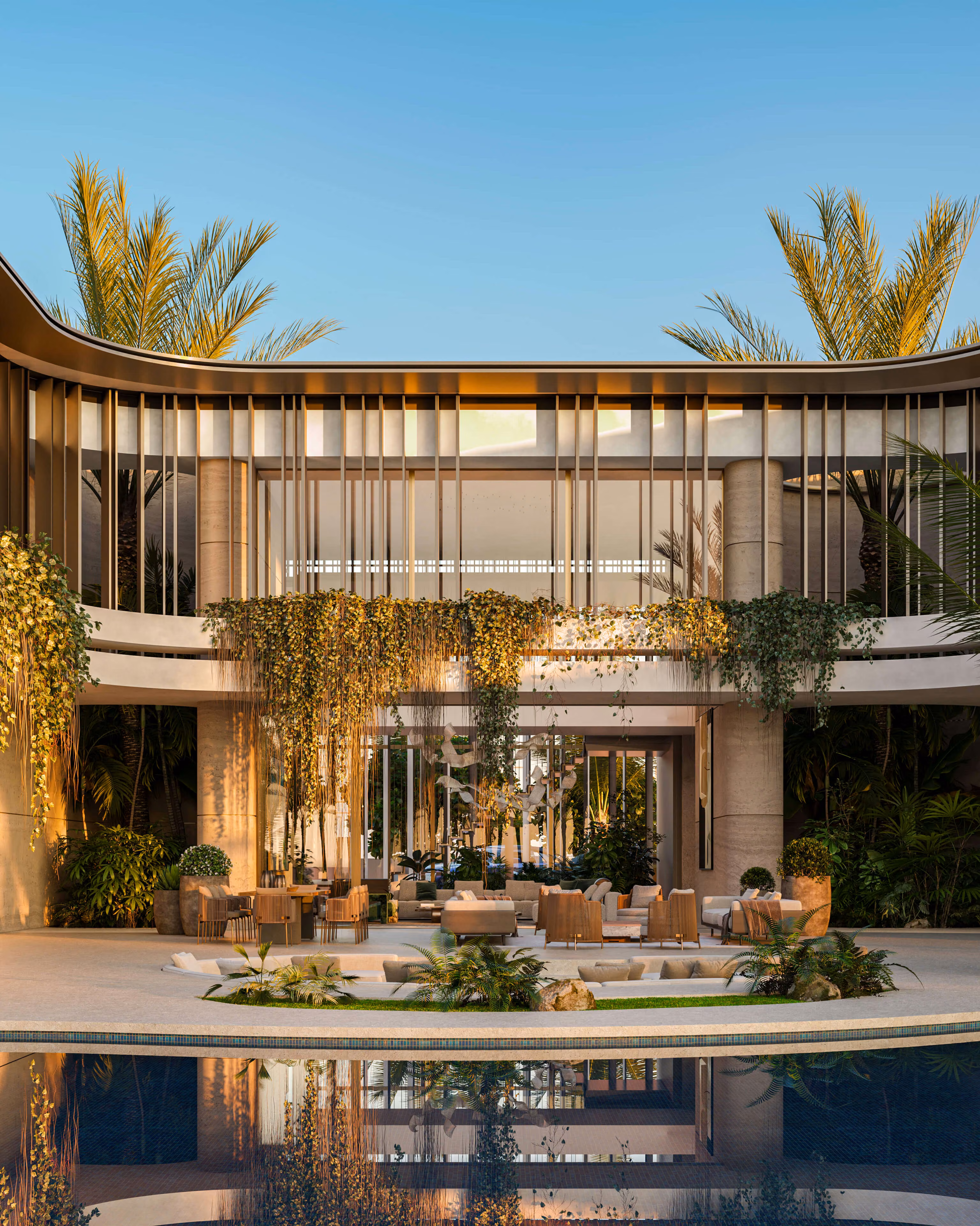 Central part of the villa with poolside seating, large windows and trailing plants.