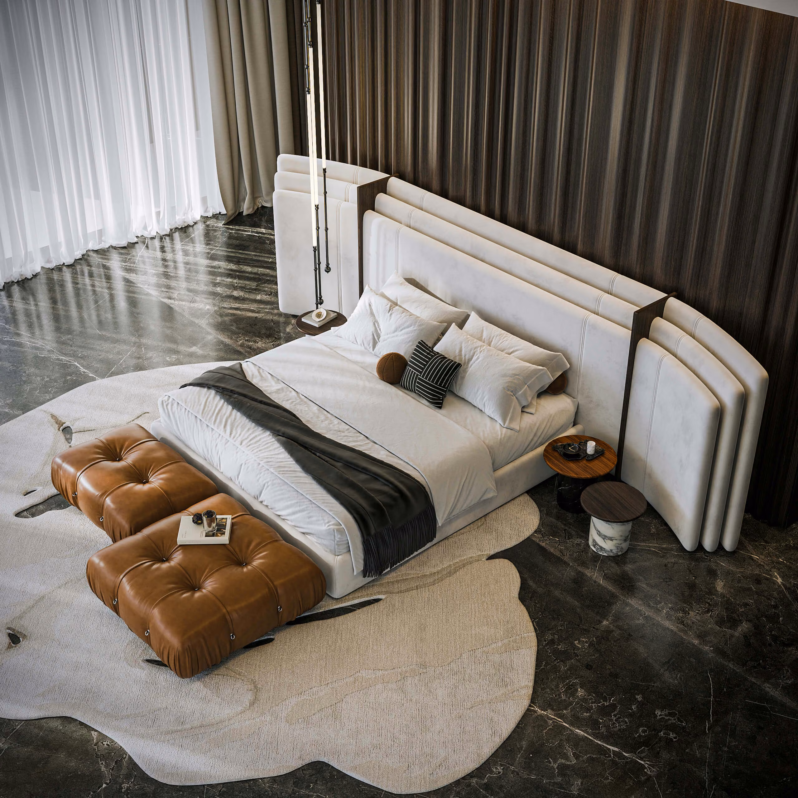 Vista elevada del dormitorio de White Prince con cabecero blanco, pufs marrones y alfombra de contorno irregular.