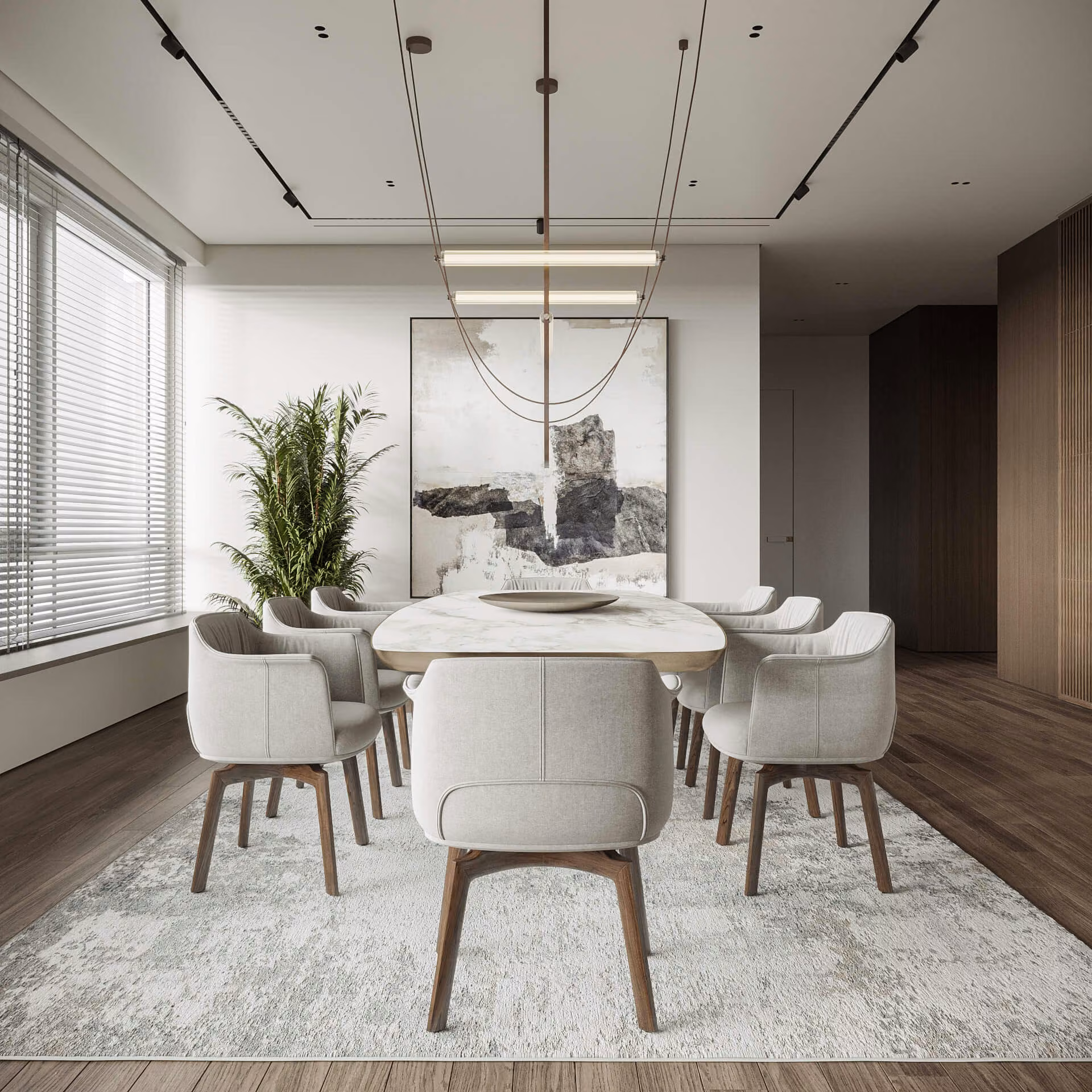 Dining room with an oval table, upholstered chairs and suspended linear lights facing an abstract painting.