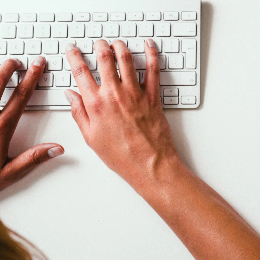 image of a person typing on keyboard
