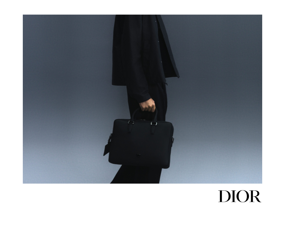 A Christian Dior advertisement of their latest collection for THE GOODS. A male model walks amongst sand mounds.
